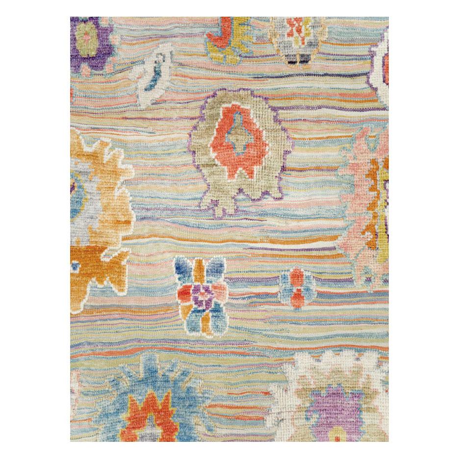 A contemporary and colorful Turkish Souf Oushak room size carpet handmade during the 21st century.

Measures: 9' 11