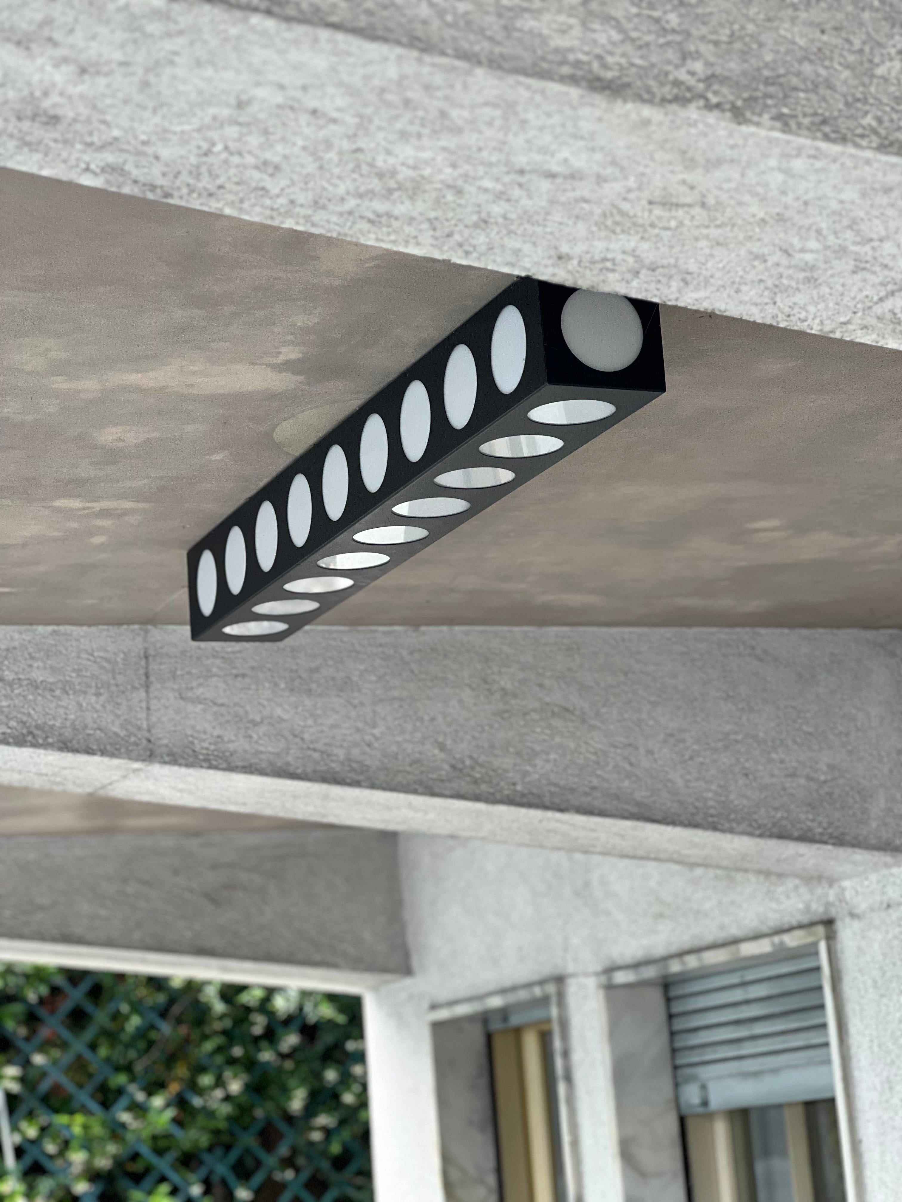 Sculptural Ceiling Lamp - Architectural Wall Light - Contemporary Industrial Wall Sconce - Dieter Rams Style - Jean Prouve Style 

Sculptural and sleek industrial-inspired sconce, suitable for wall or ceiling mounting. A rectangular metal box,