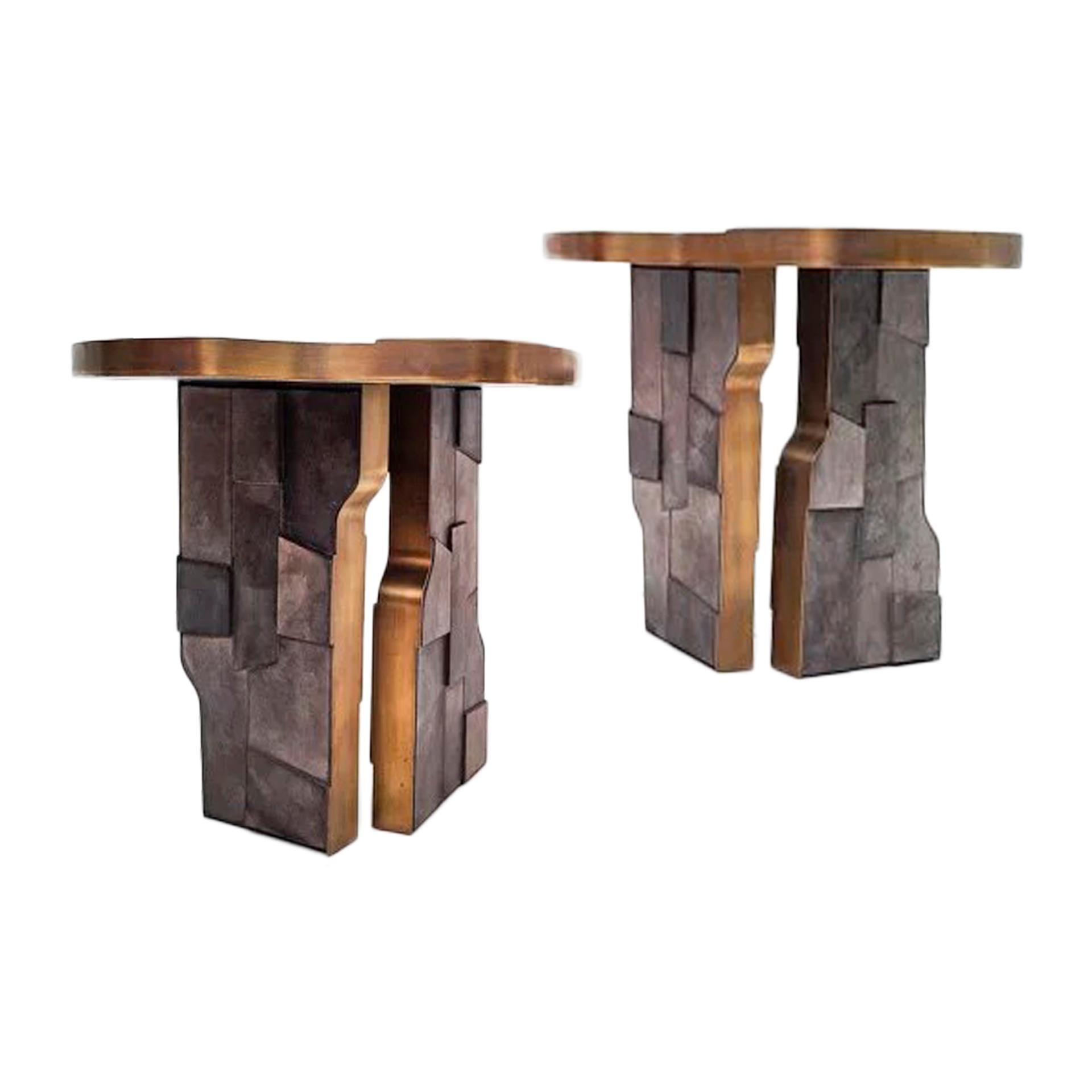 Pair of asymmetrical side tables covered in anthracite ceramic and brass. Handmade using the Japanese Raku technique.  These side tables are a unique piece, designed exclusively for LA Studio. Made in Italy 2023.
 
Raku-yaki, also known as Raku