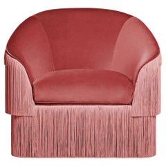 Fauteuil contemporain en velours rose antique avec franges en soie