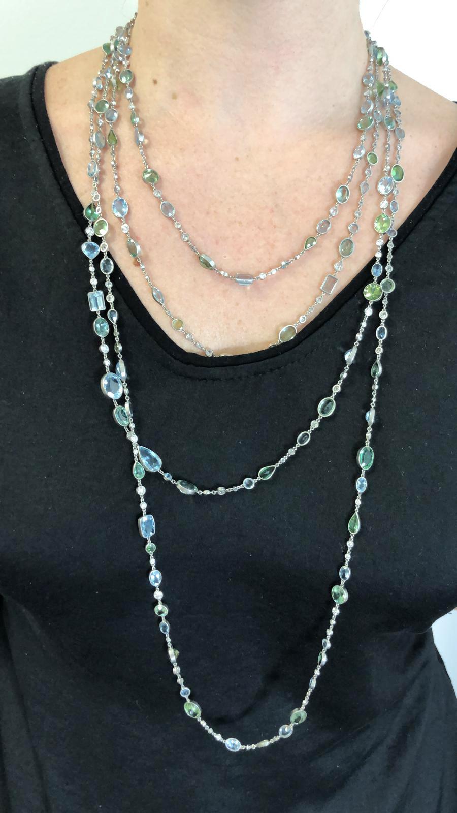 Aquamarine Tourmaline Diamond Necklace in Platinum, 20 inch necklace

Faceted aquamarines, tourmalines in tones of sea blue and green are accented with white diamonds throughout. Gemstones are cut into oval, pear and round shapes, all mounted in