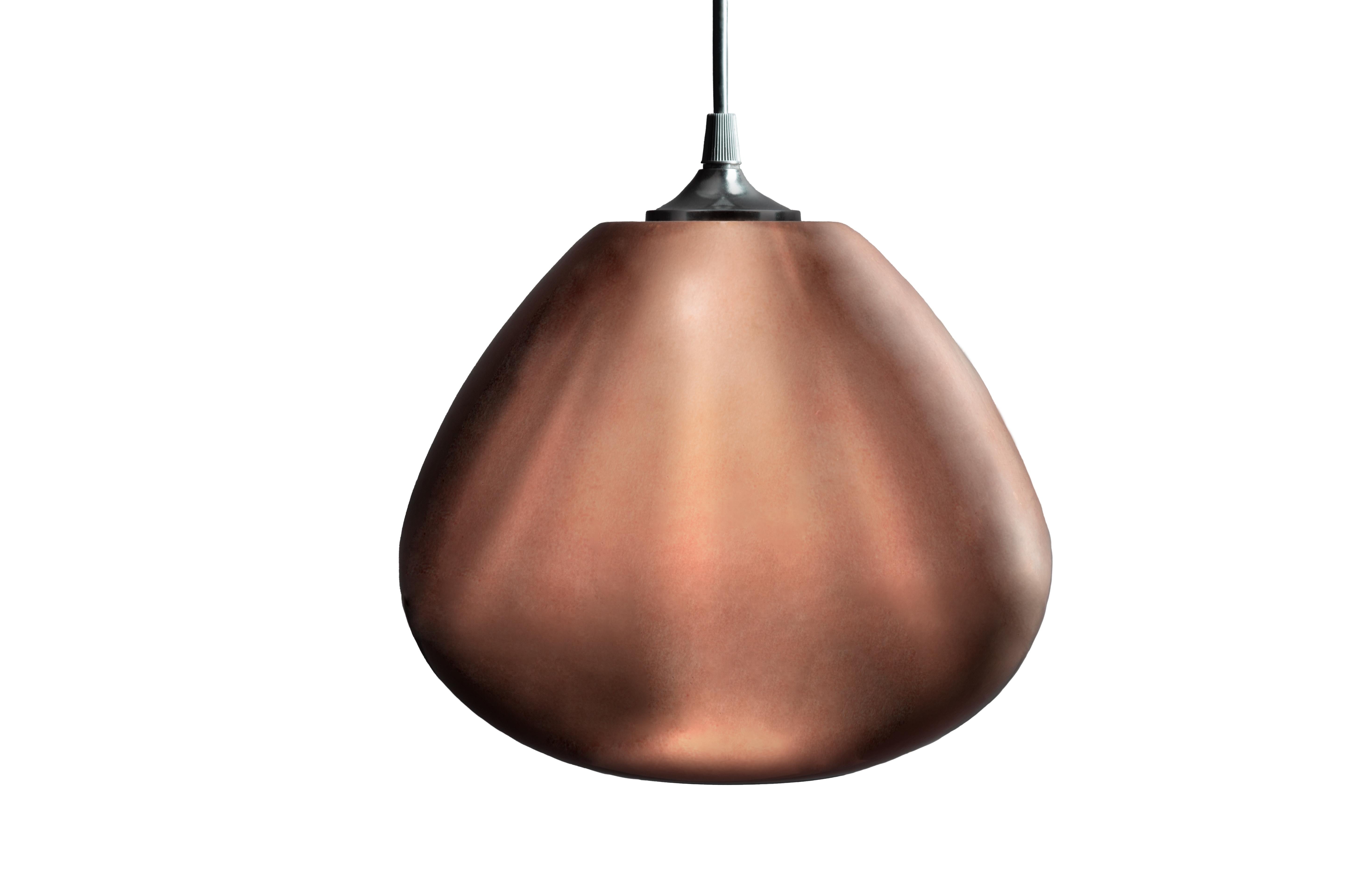 The Perla Cobre by Luminosa. The splendid hand-blown glass pendant lamp with reflective copper patina. Sumptuous reflective copper when switched off the Perla copper lamp emerges into a warm transparent glow when moonlighting. Perfect for creating