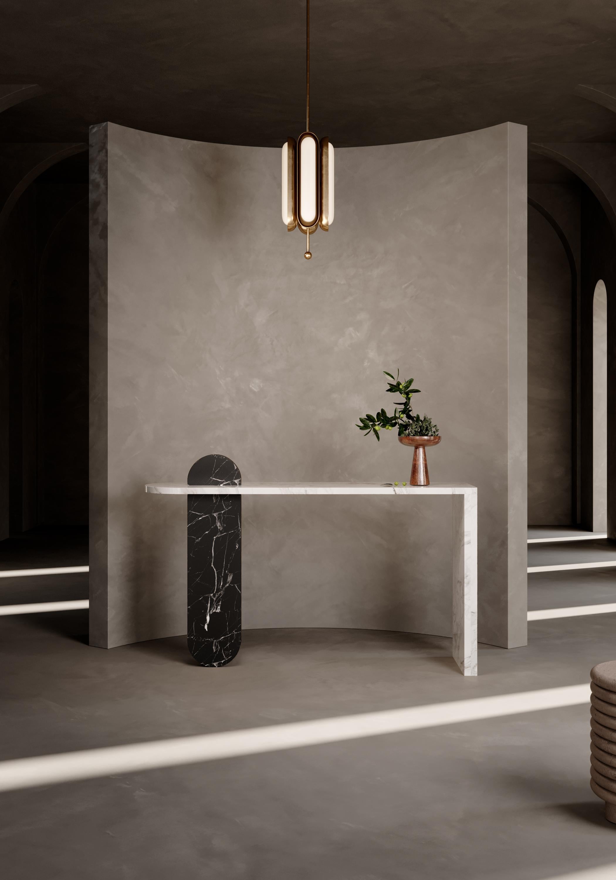 Simulating a sun rising, two marble pieces delicately interject, creating a visually enchanting marble tabletop filled with depth and character. Mixing natural textures and functional clean compositions create a feeling of harmonious celebration.