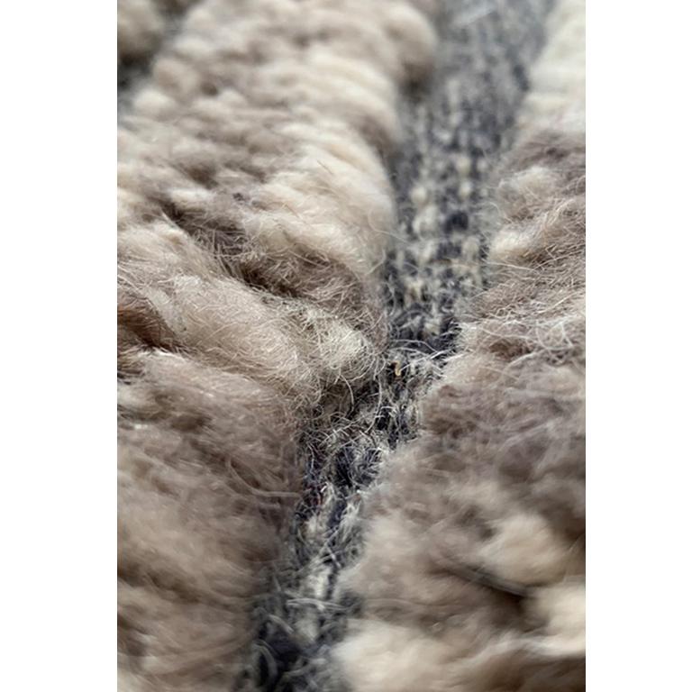 Crafted by hand our Landscape rug owes its unique look thanks to the hand knotted flat-weave construction combination and a blend of natural color yarns. Its subtle atmosphere can instantly dress up or ground a room be it modern, rustic or a house