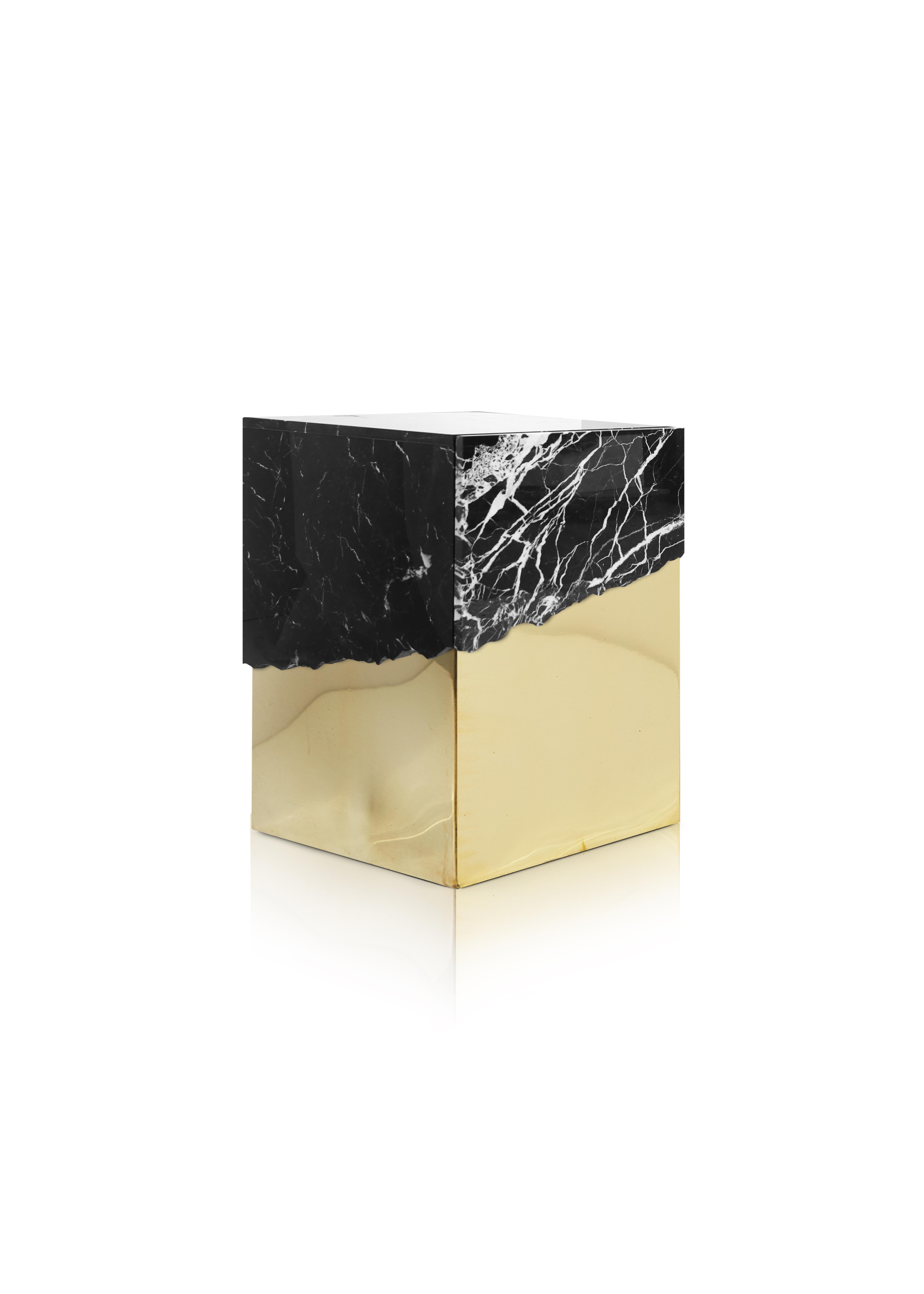 Our latest piece, the side table, is an elegantly designed work of art that is sure to make a bold statement in any room. The side table is crafted from a stunning combination of black marble and polished brass, creating a striking contrast of