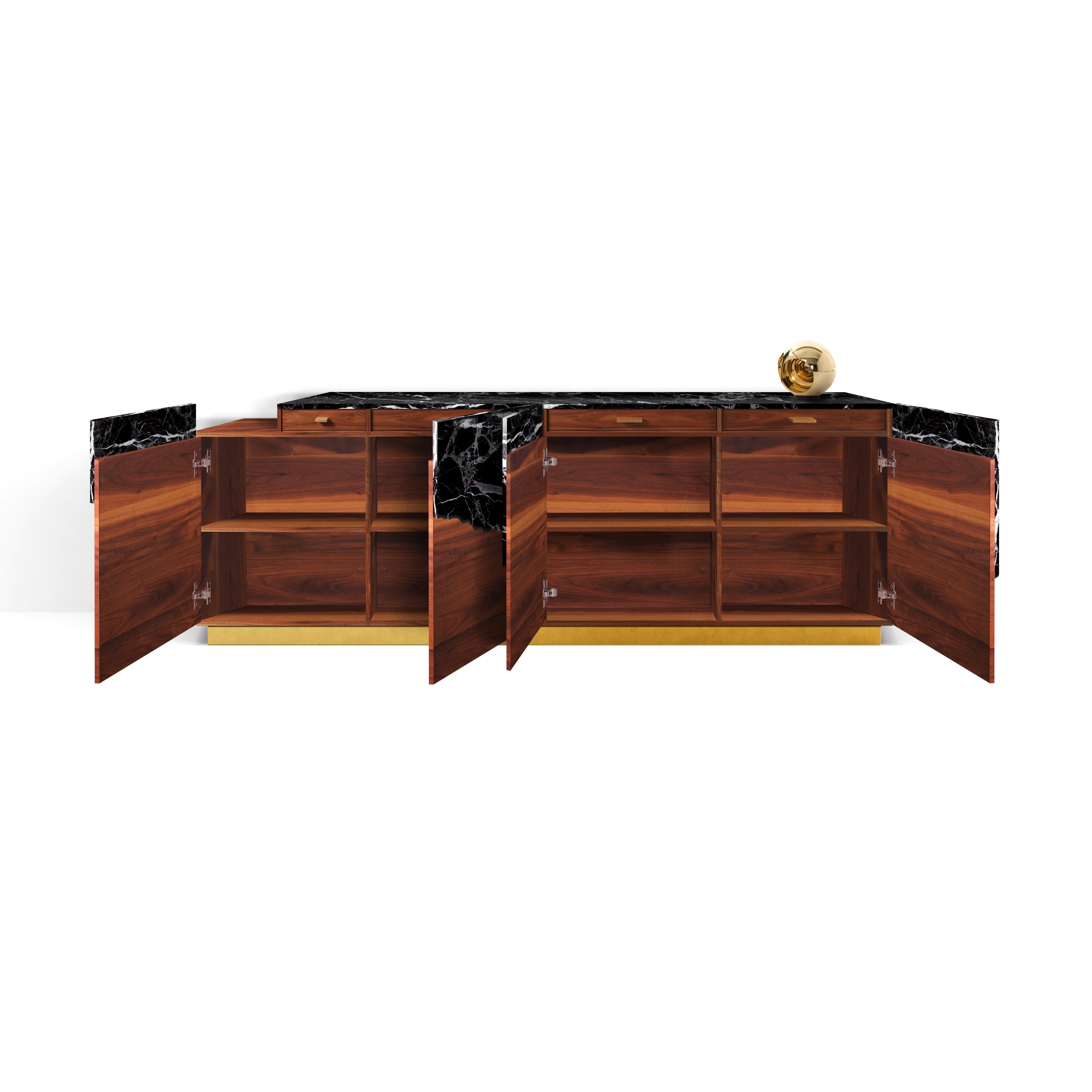 Directly inspired by natural beauty of Iceland. Made of live edge black marble, American walnut veneer and brass.
Contemporary, luxurious and impeccably crafted, this credenza makes a beautiful home investment. The design works a clean-lined body