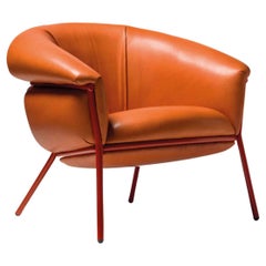 Fauteuil contemporain 'Grasso' de Stephen Burks, cuir orange, structure rouge