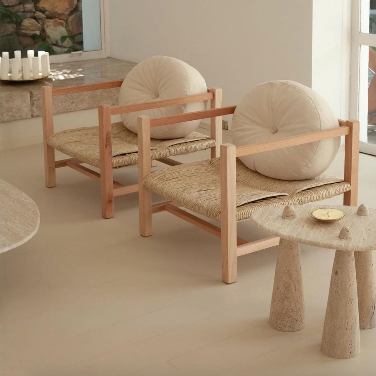 This contemporary armchair in wood and braided straw with raw cotton cushion was meticulously handmade by master artisans one piece at a time. It is therefore quite difficult, if not impossible to make identical items. The projects are based on a