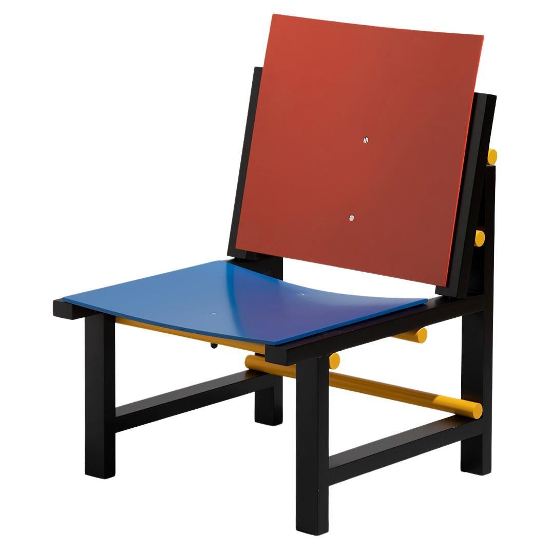 Fauteuil contemporain moderne en bois rouge, bleu, jaune et noir de Marc Morro