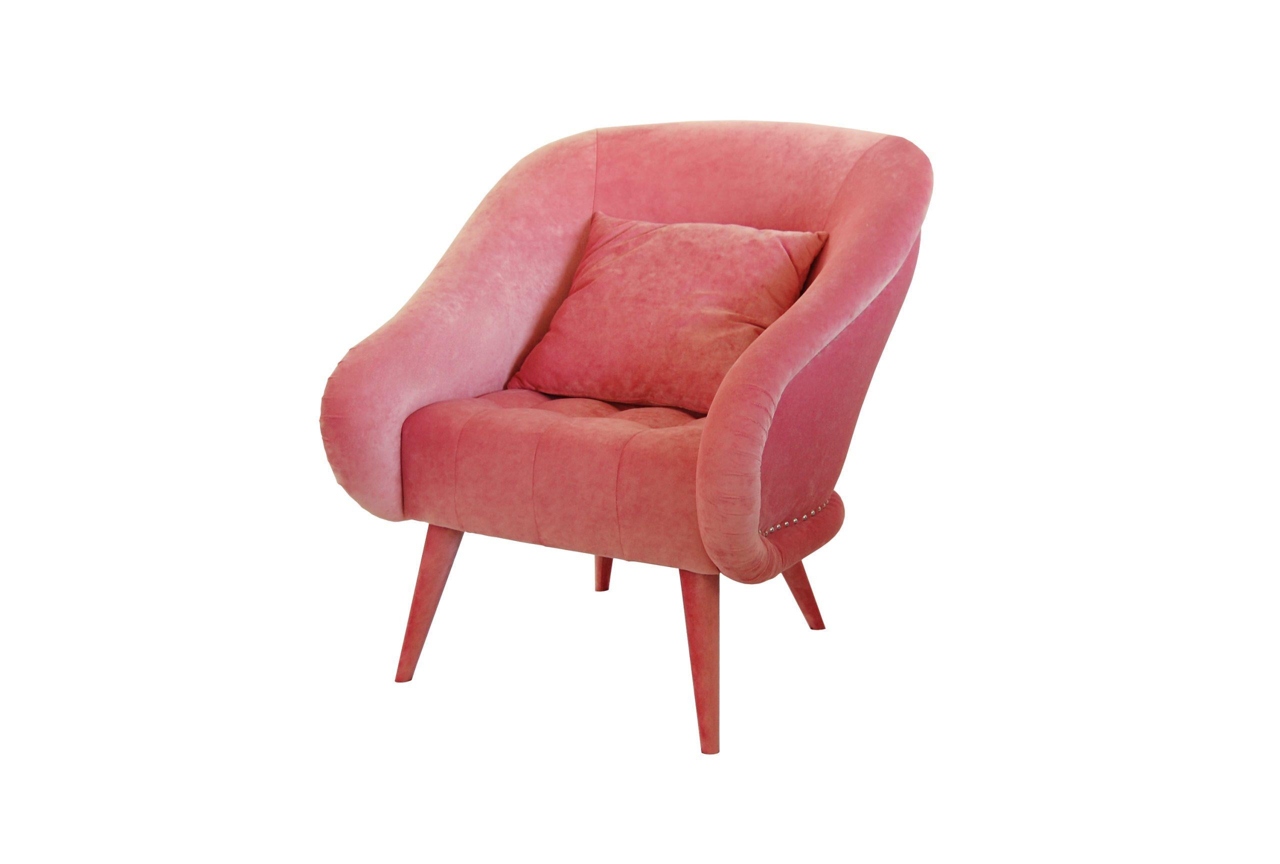 The silhouette and structure of this piece are immediately familiar, reminiscent of the art deco armchair with a modern, clean design. The seat, backrest, arms and legs are all covered with luxurious cotton velvet upholstering. The arms and backrest
