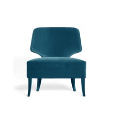 Fauteuil contemporain proposé en velours avec lignes courbes au dos