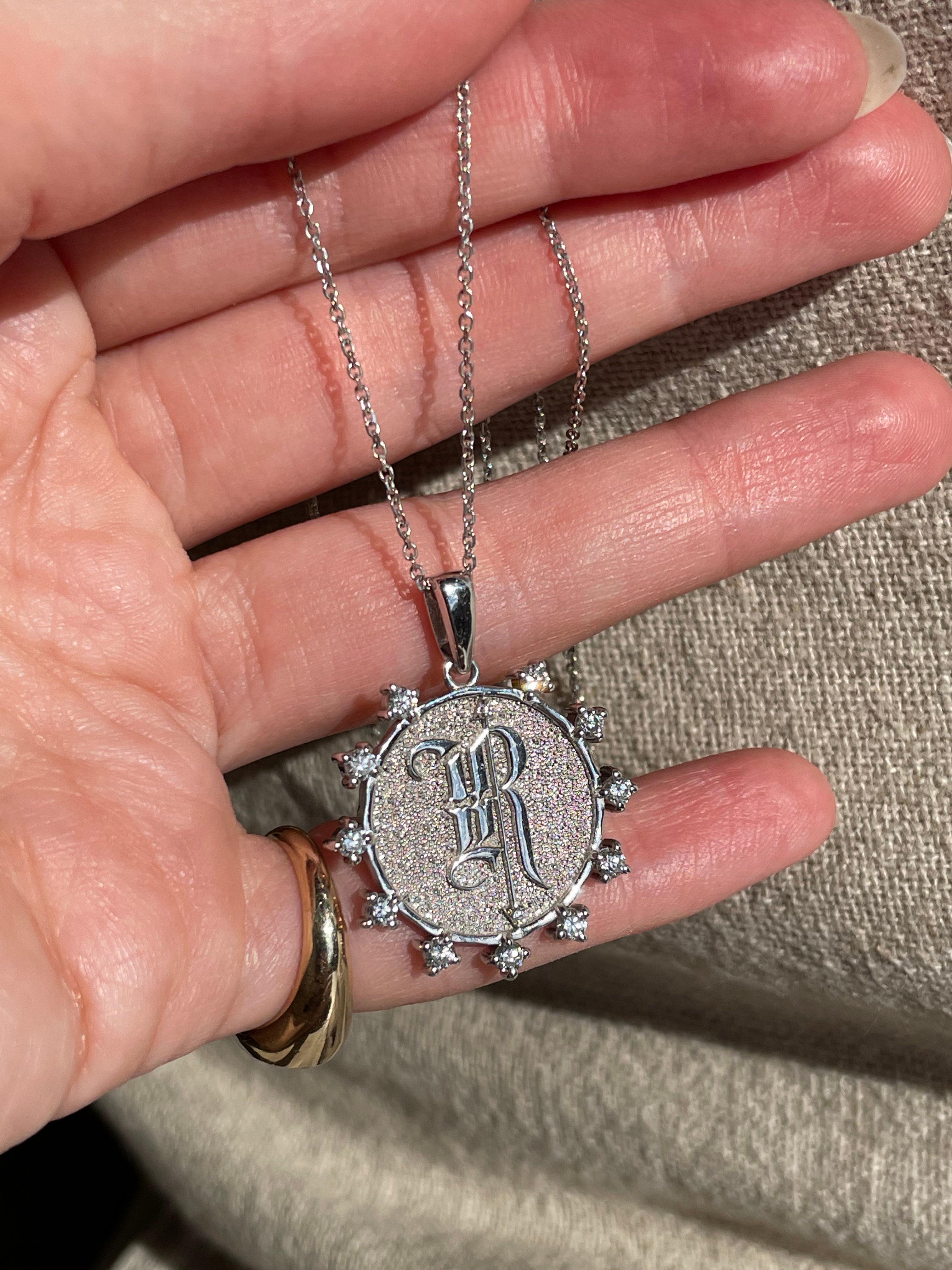 The Rune Medallion celebrates whomever you decide: state yourself or carry a loved one (or two) wherever you go. The Rune Medallion features a crown of 11 diamonds and 2 inner diamonds for over .50 total carat weight. Each Rune Medallion is