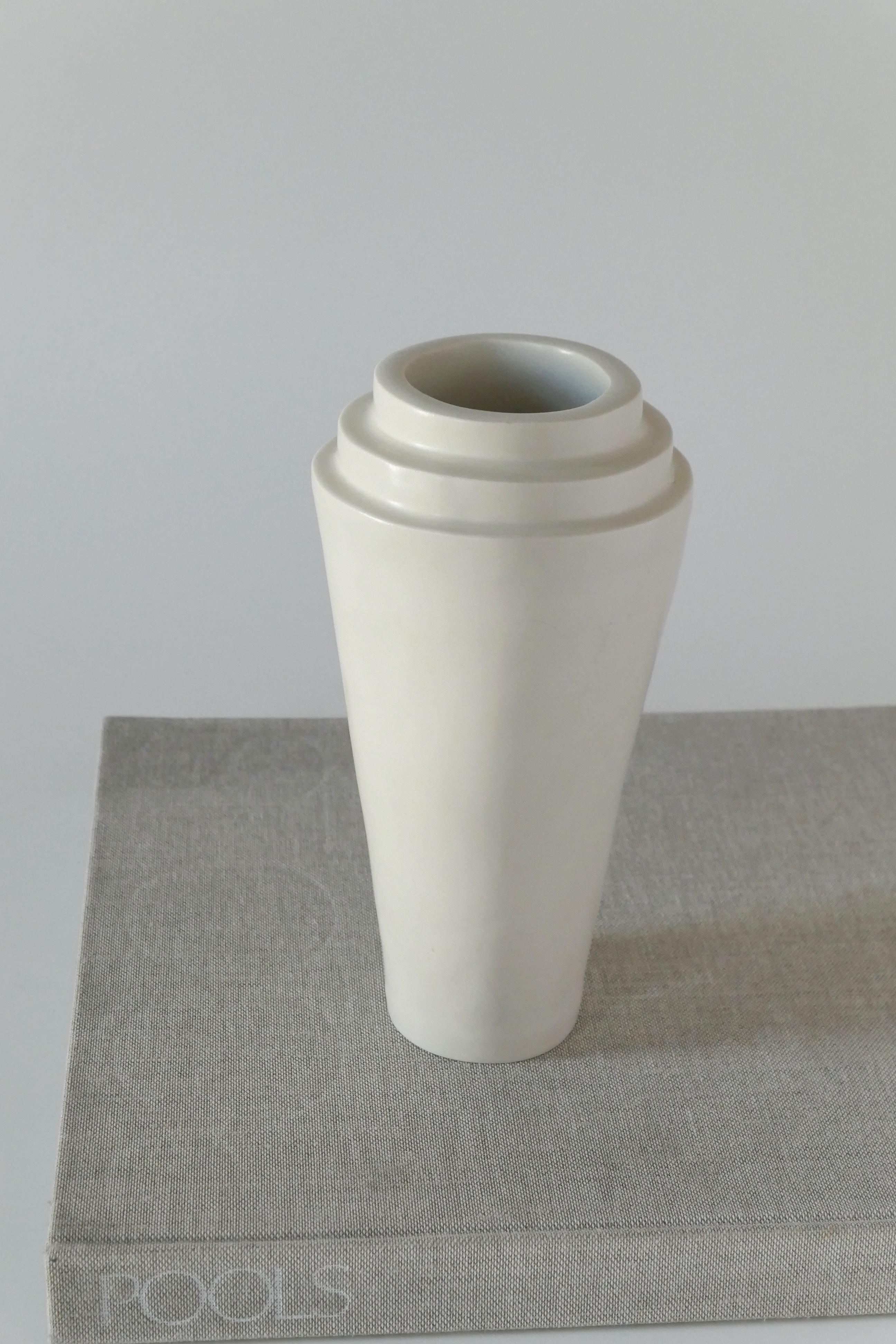 Off-white handbuilt stoneware vase finished with a soft clear glaze. 

Karina Vieira is a Brooklyn-based ceramicist focusing on handbuilt vessels. 

Her work references various styles, touching on the pre-Hispanic, the Bauhaus and Art Deco,