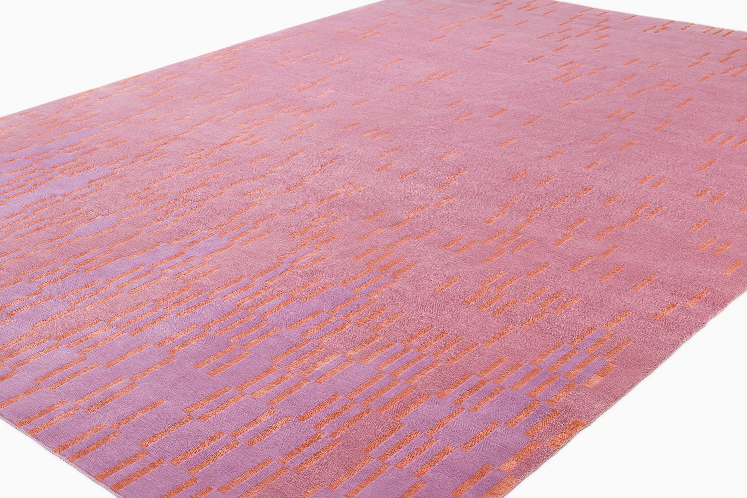 Quadrophenia is one of Joseph Carini's latest luxurious carpet designs. Its magic can't be captured on camera! A mohair background with a silk design, Quadrophenia is radiant, capturing the light on its expansive field that is both geometric and