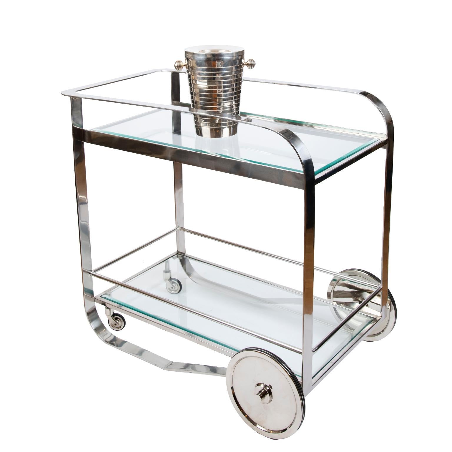 Great design and a great look describe this sleek and stylish metal bar cart beautifully made from polished steel with two tempered glass shelves.
