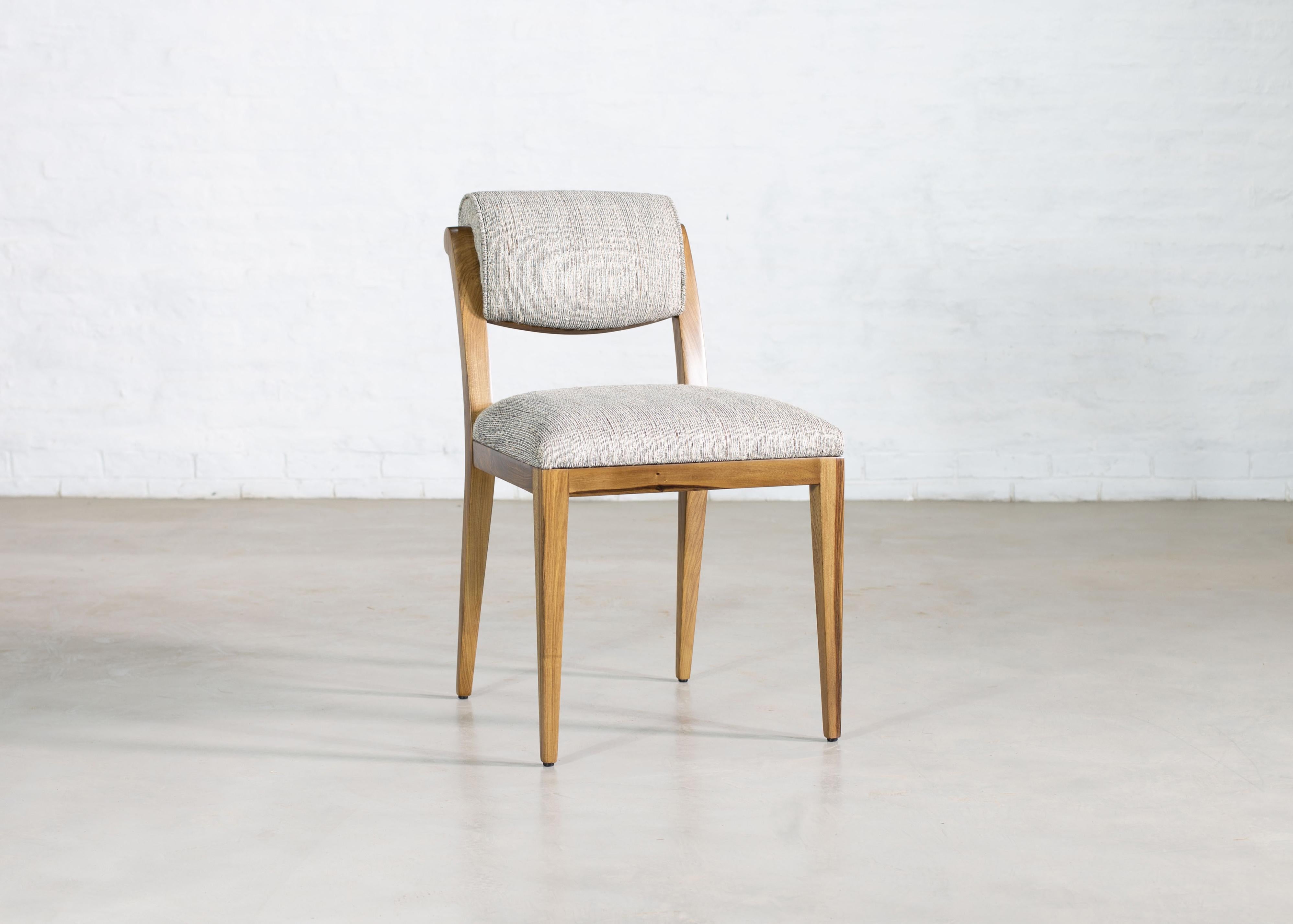 Costantini prides itself in using the hardest and most beautiful hardwoods in the construction of its line of seating. The Gianni dining chair borrows cues from the early 20th century Art Deco masters and features a light frame with a scrolled back.