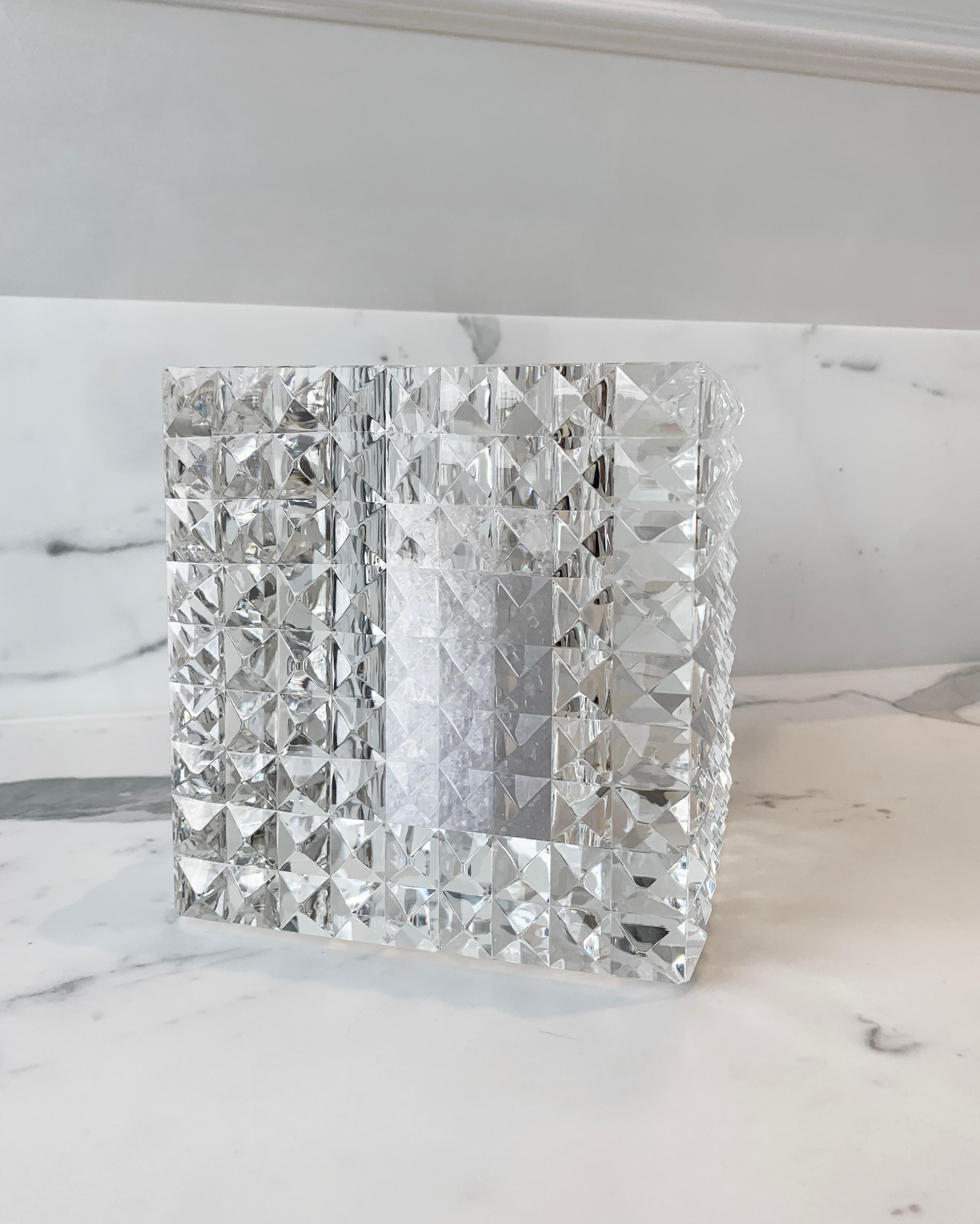 Introducing the Square Pyramid Faceted Vase by Veritas Home—an exquisite testament to modern luxury. Crafted in 2014, this glass masterpiece transcends traditional design boundaries. 

Veritas Home, synonymous with contemporary sophistication,