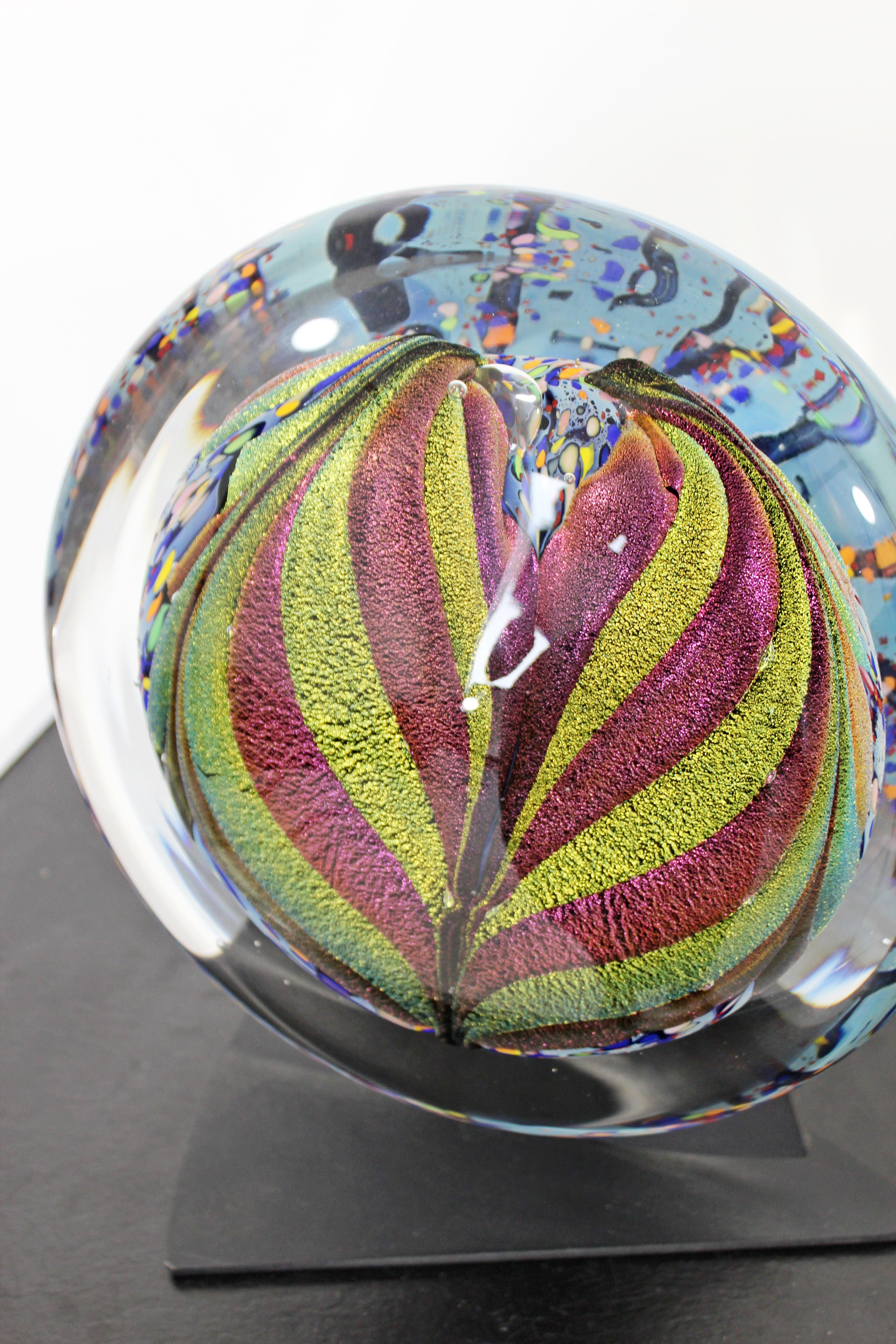 For your consideration is a fabulous piece of glass art on a black metal base, with a tulip shaped design, signed on the bottom of the glass by Rollin Karg, dated 2002. In excellent condition. The dimensions of the glass are 11