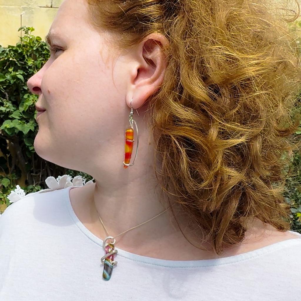 Award-winning Tara Lois was influenced by the Art Nouveau style when she designed these contemporary organic earrings. The slightly asymmetric abstract curves in each earring have been handcrafted in the contour of a hill in Gozo, Malta, from
