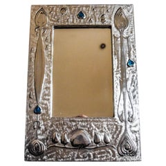 Retro Contemporary Arts and Crafts Pewter Mirror with blue Cabuchons