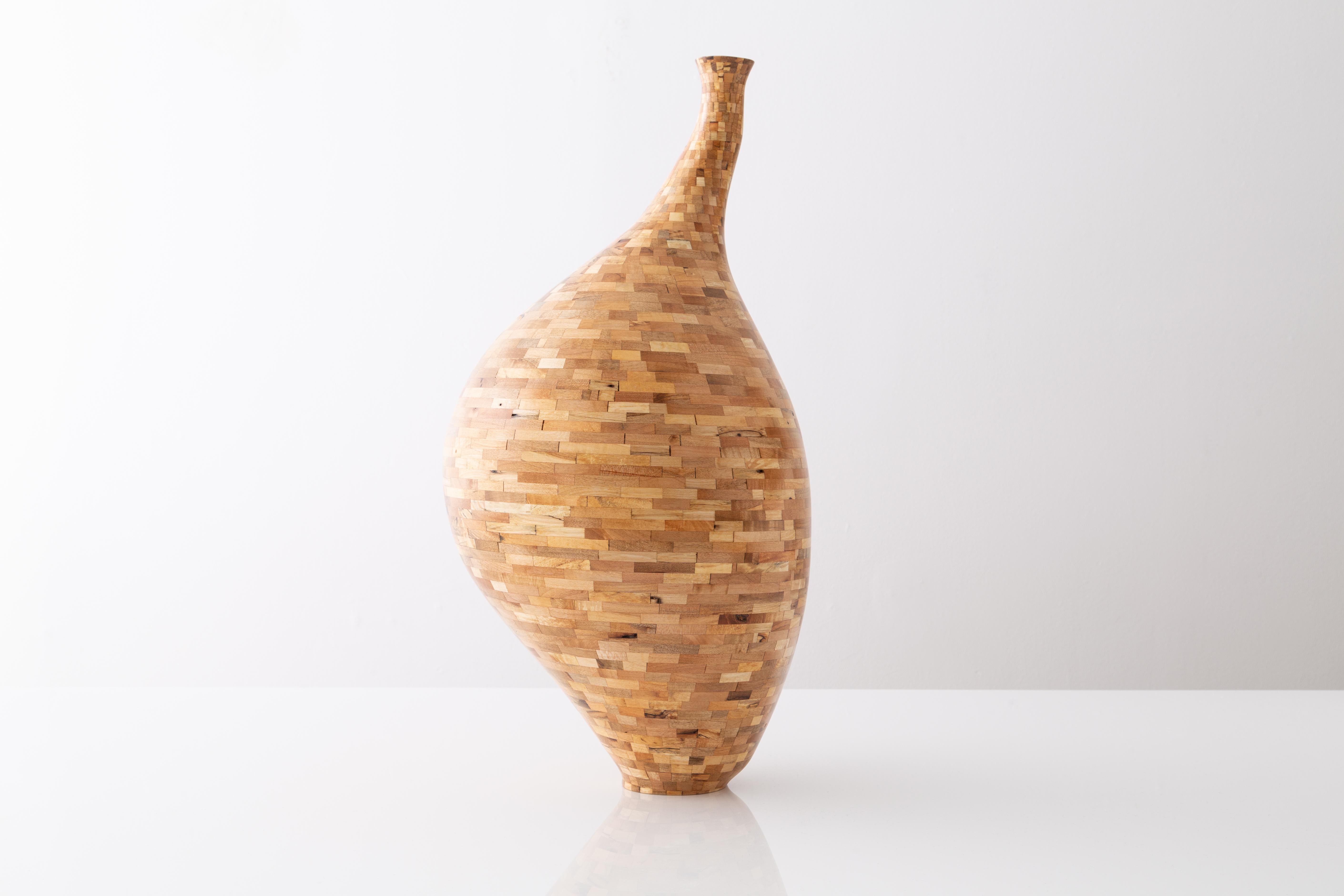 This asymmetrical vessel was created from salvaged spalted maple. The wood's natural coloring shows off tones range all-over the place from yellow and blonde, to pink and deep browns with black striations and quilting throughout, kinda reminiscent