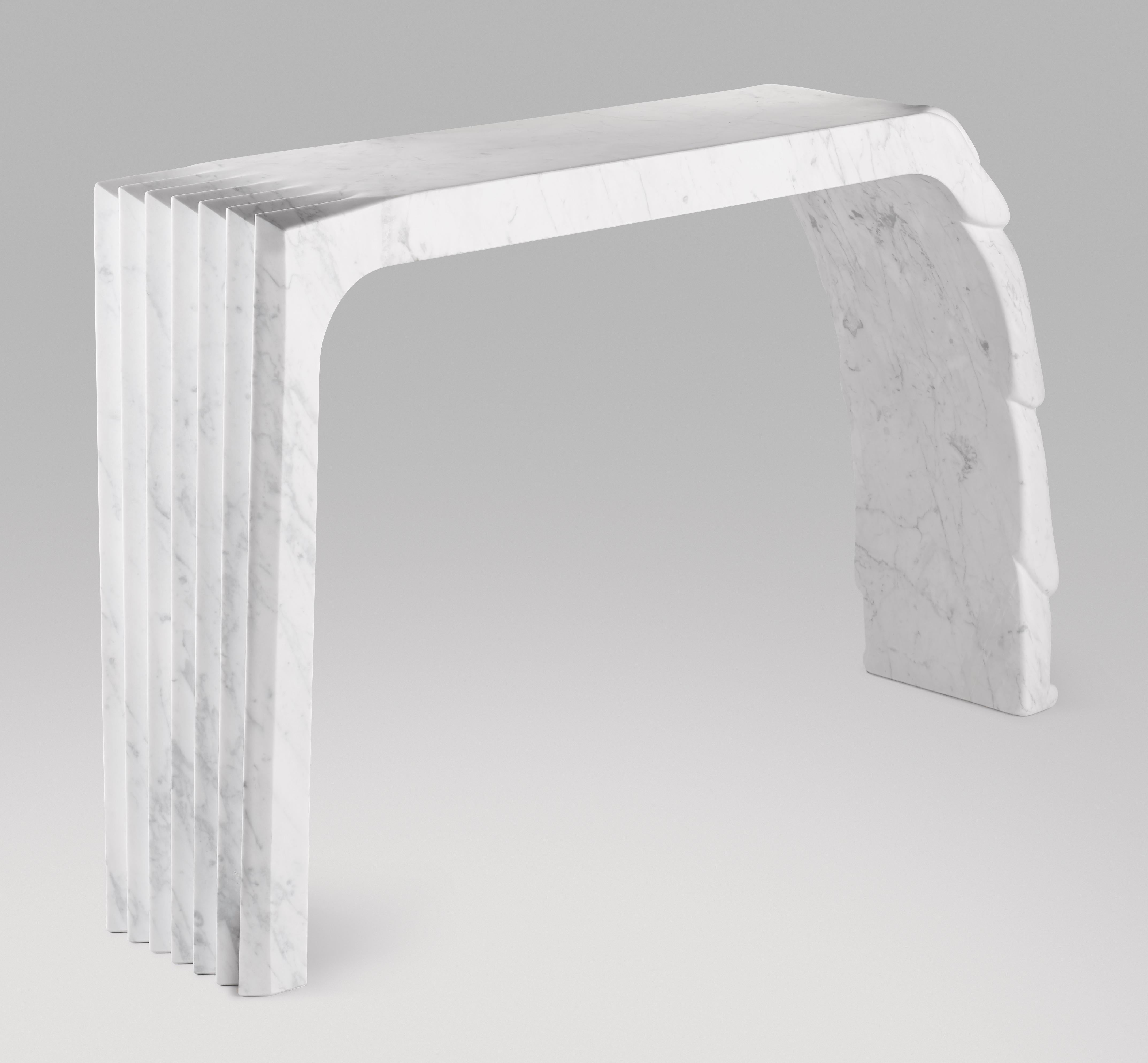 Cosulich Interiors in collaboration with Atelier Terrai: Bespoke console, entirely handcrafted in Italy, out of one solid block in white Carrara marble with an elegant satin finish. The Evolution collection, an organic modern design series, is