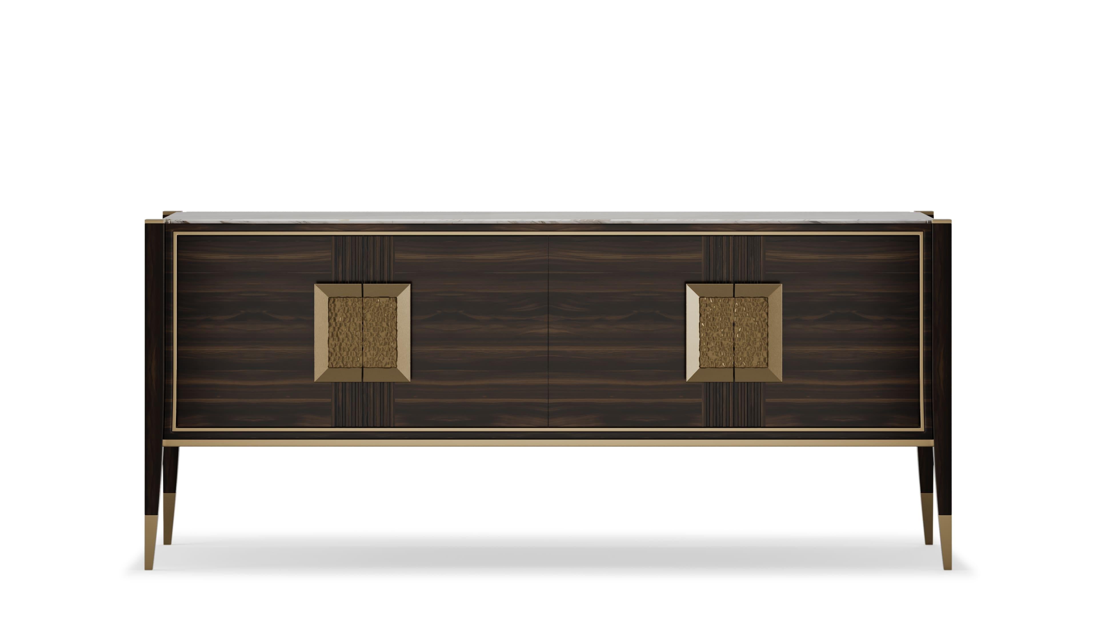 A stylish sideboard that combines modern elegance with functional design. The wooden structure features subtle brass grooves and details, adding sophistication to its appearance. The top is crafted from luxurious marble, providing a striking