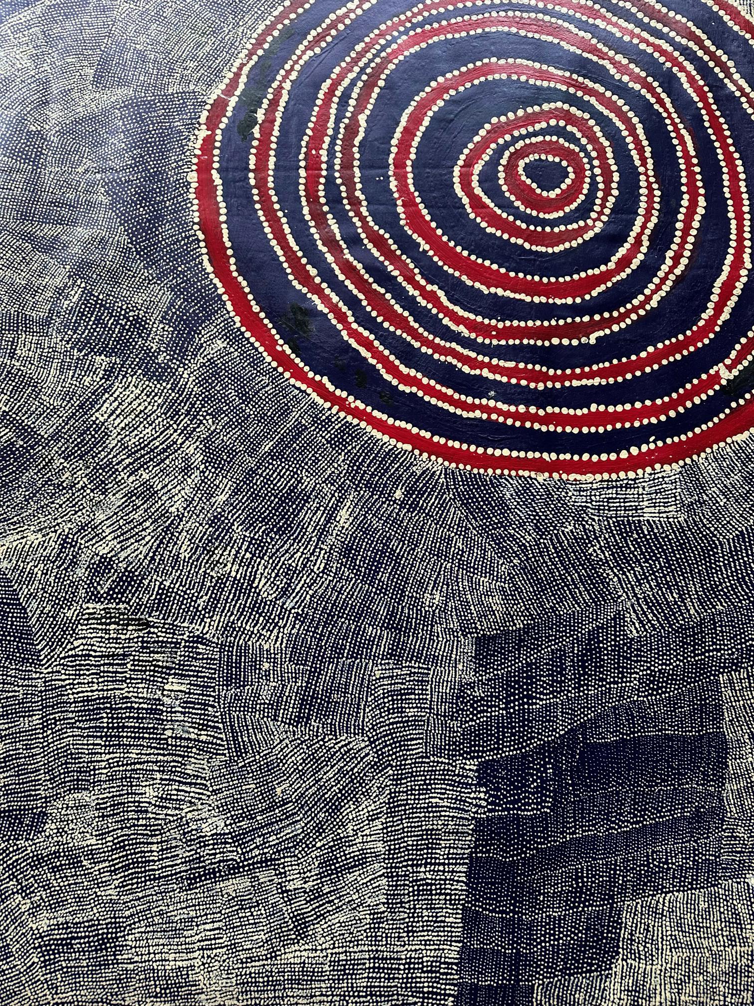 A stunning abstract painting by Australian Aboriginal artist Wentja Napaltjarri (c1945 - 2021) entitled Rockhole West of Kintore, the work depicts the artist's ancestral land in Dreamtime. Diminated the painting, the concentric form is the site of