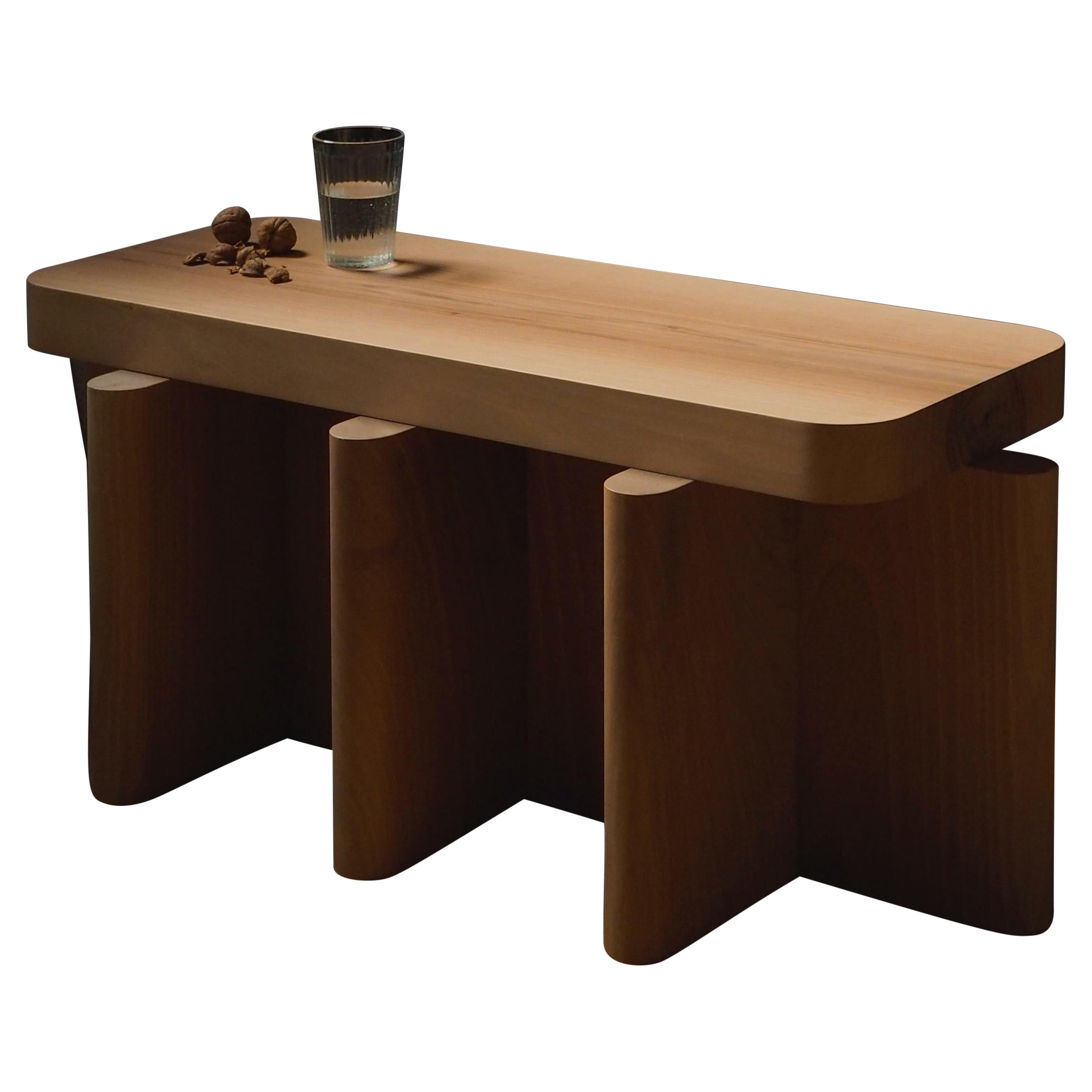 Spina is a collection of lacquered tables and seatings.

The lacquered surfaces and consistent rhythm of the planes create a visual play of light, shadow and reflection, adding depth and richness to this already visually graphic collection. The