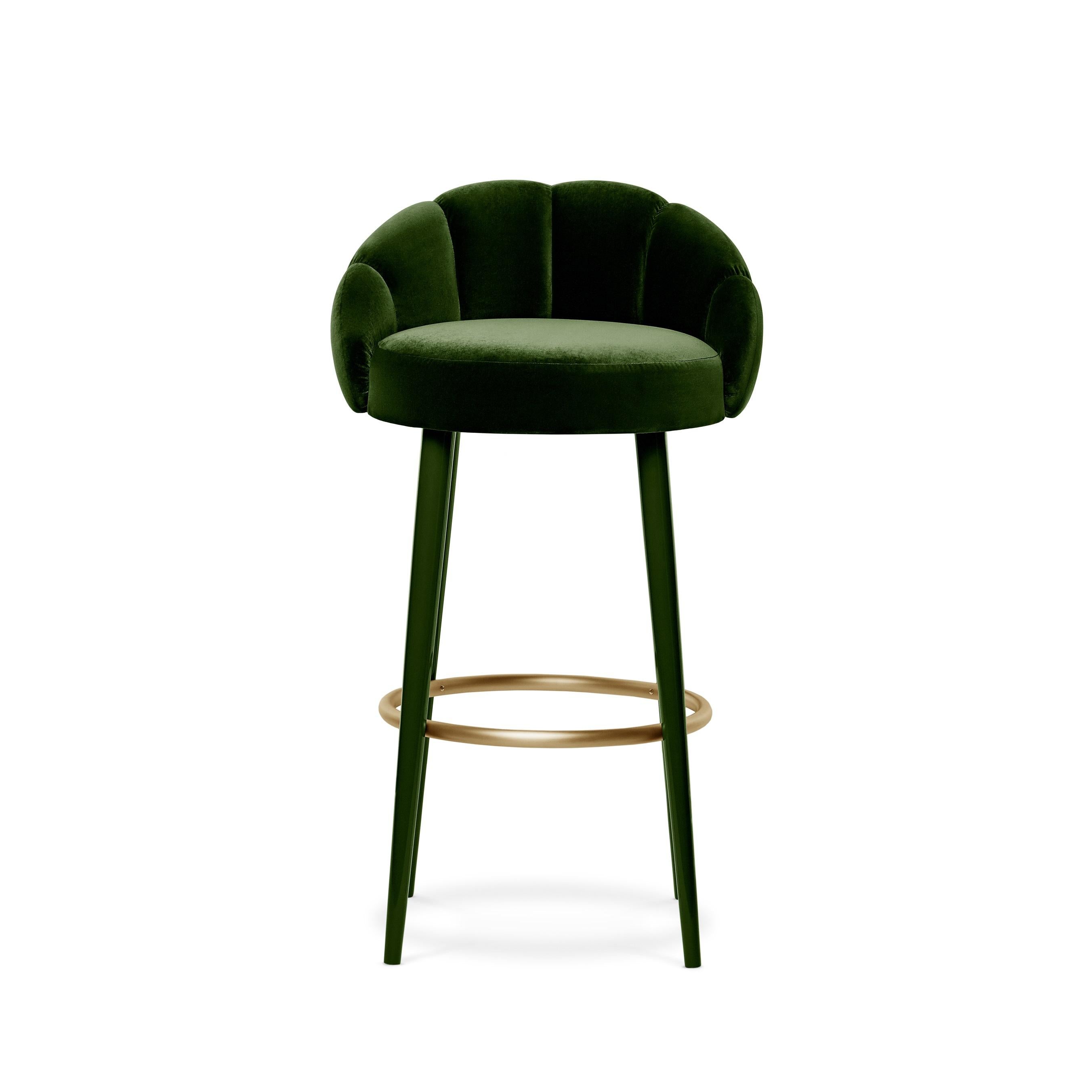 This barstool projects pure haute couture, with its sensuous feminine outline and voluptuous shape. Each exquisite curve features detailed seaming through the front to back, standing on long and sleek legs and a metal ring. It becomes the pièce de
