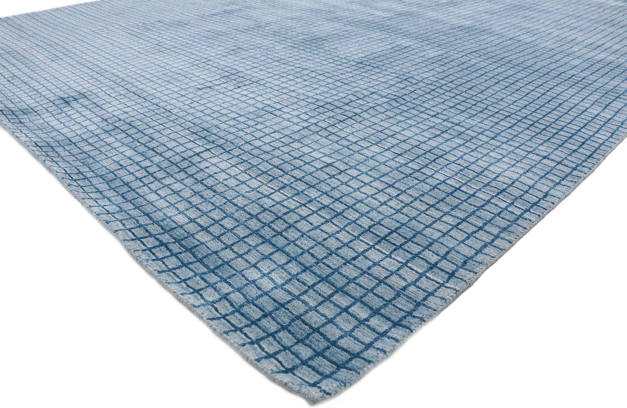 30436, contemporary Beach style area rug with grid pattern and Coastal Living style. This hand knotted wool modern beach style area rug features a simplistic all-over geometric pattern spread across an abrashed light sky blue backdrop the dark