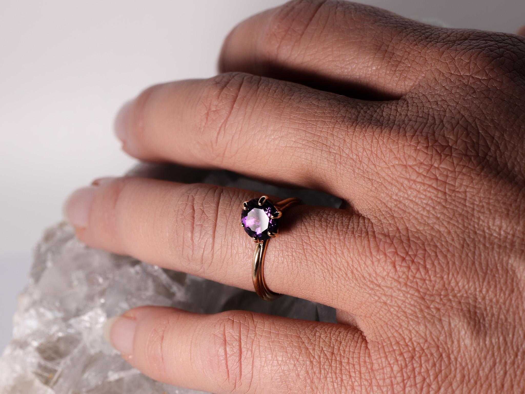 18K Rose Gold Made in Italy Asymmetric Cosmic Design Stackable Amethyst Cocktail Ring.
The Egle ring is made of 18 karat rose gold and features a round mixed cut natural amethyst around 1.68 carats, diameter 7.8 mm. The total weight of the ring is
