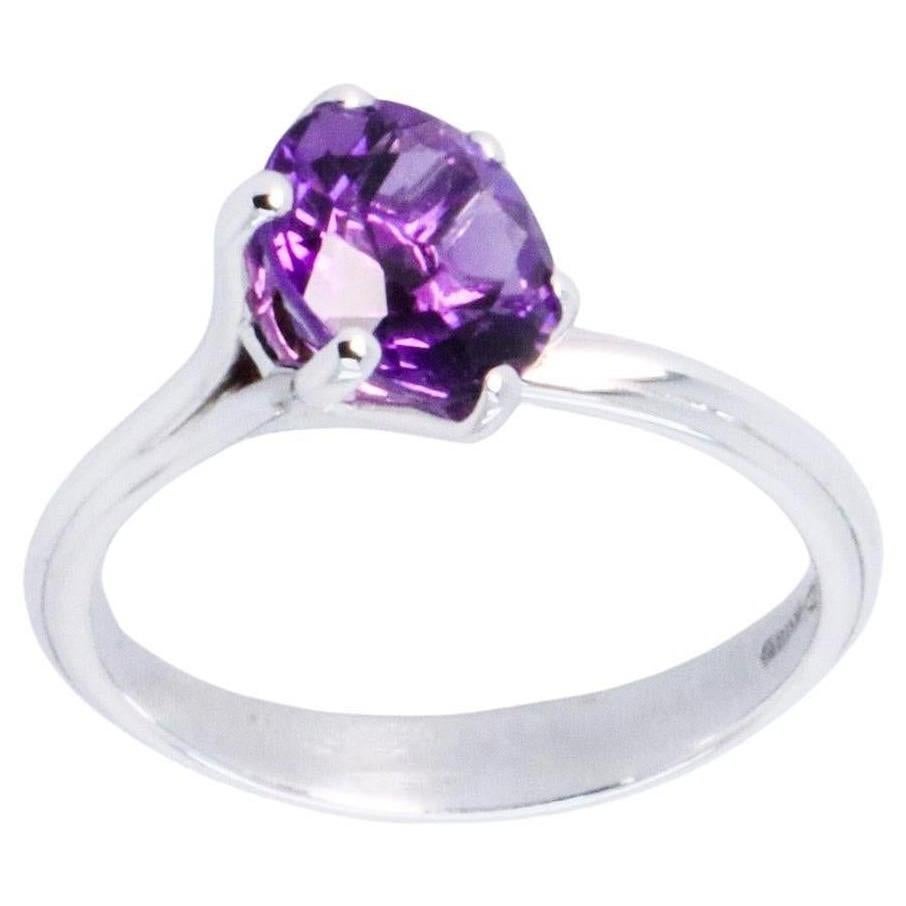 18k White Gold Made in Italy Amethyst Stackable Asymmetric Cosmic Cocktail Ring.
The Egle ring is made of 18 karat white gold and features a round mixed cut natural amethyst around 1.68 carats, diameter 7.8 mm. The total weight of the ring is 3.7