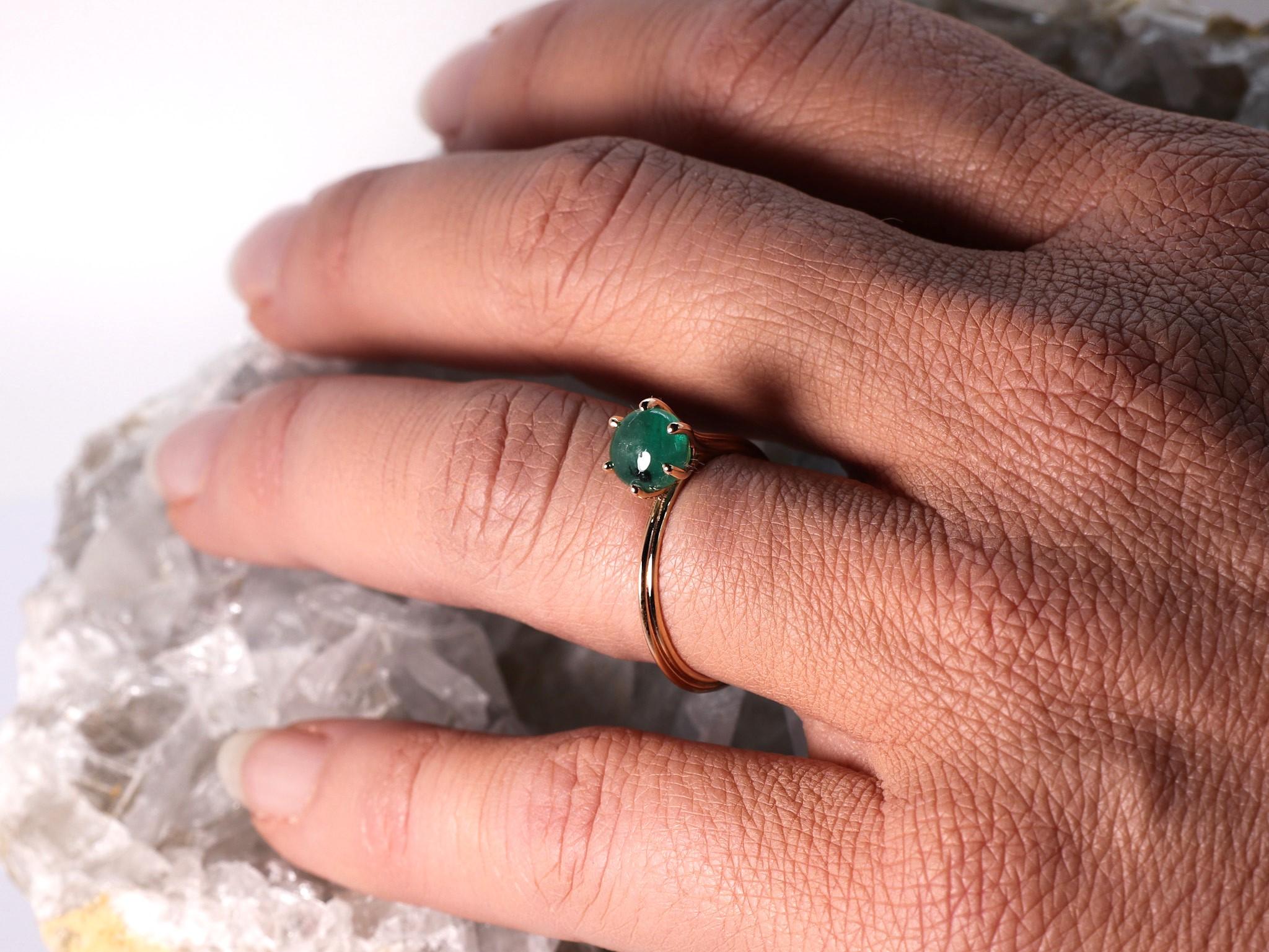 1.4 cts Emerald 18K Rose Gold  Asymmetric Cosmic Design Stackable  Cocktail Ring.
The Egle asymmetrical stackable ring is made of 18 karat rose gold and features a round cabochon cut natural Emerald around 1.40 carats, diameter 6.4 mm. The total