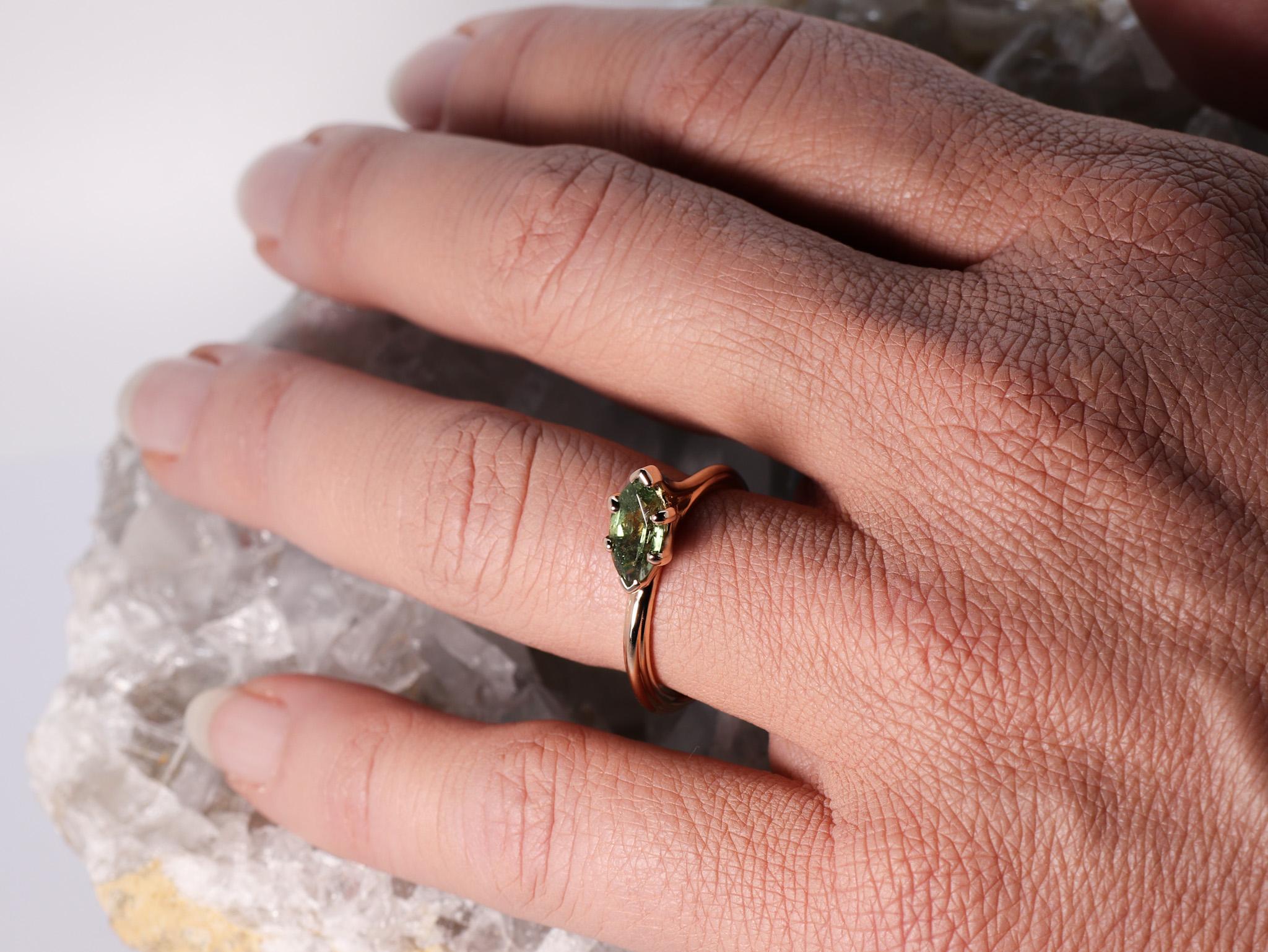 18K Rose Gold Asymmetric Design Stackable Intense Green Tormaline Cocktail Ring
The Egle ring is made of 18 karat rose gold and features a marquise mixed cut natural dark green tourmaline around 1.33 carats, which measures 4.7 mm by 11 mm by 4 mm.