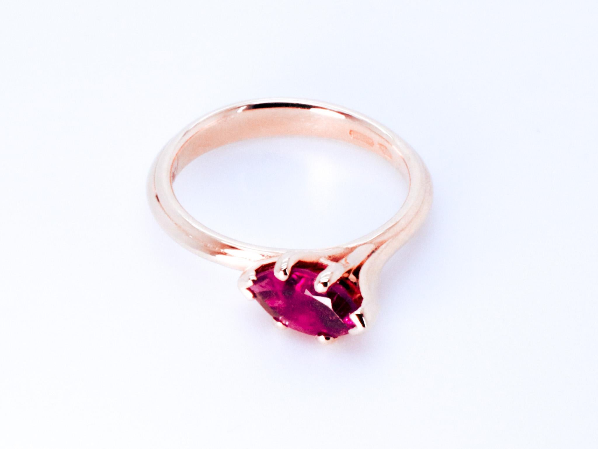18k Rose Gold Asymmetric Cosmic Design Stackable Marquise Rubellite Cocktail Ring.
The Egle ring is made of 18 karat rose gold and features a marquise  mixed cut natural rubellite around 1.26 carats, which measures 4.9 mm by 10 mm by 4 mm. The total