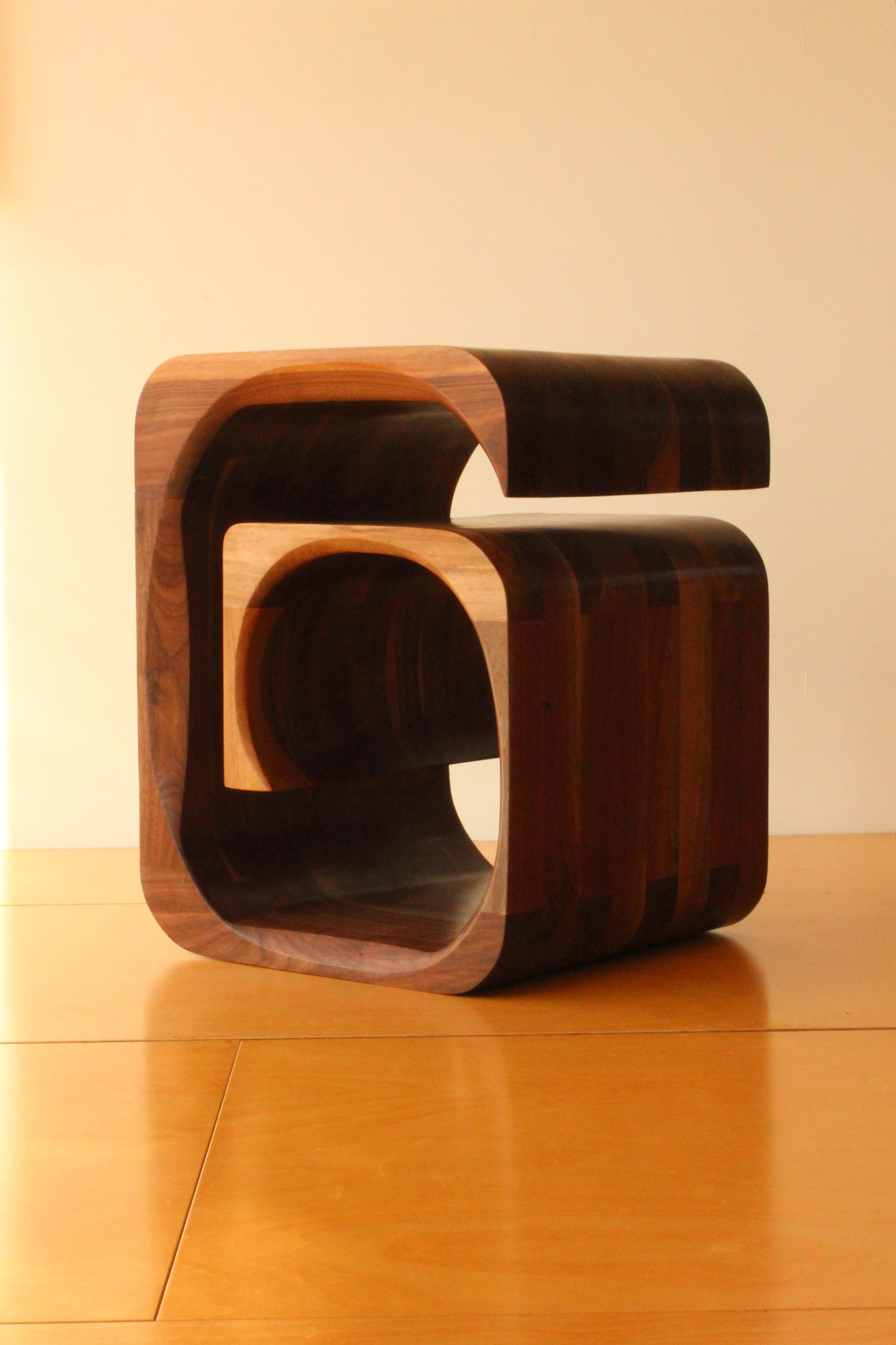 Laminated A pair of side tables in solid American black walnut by Jonathan Field.