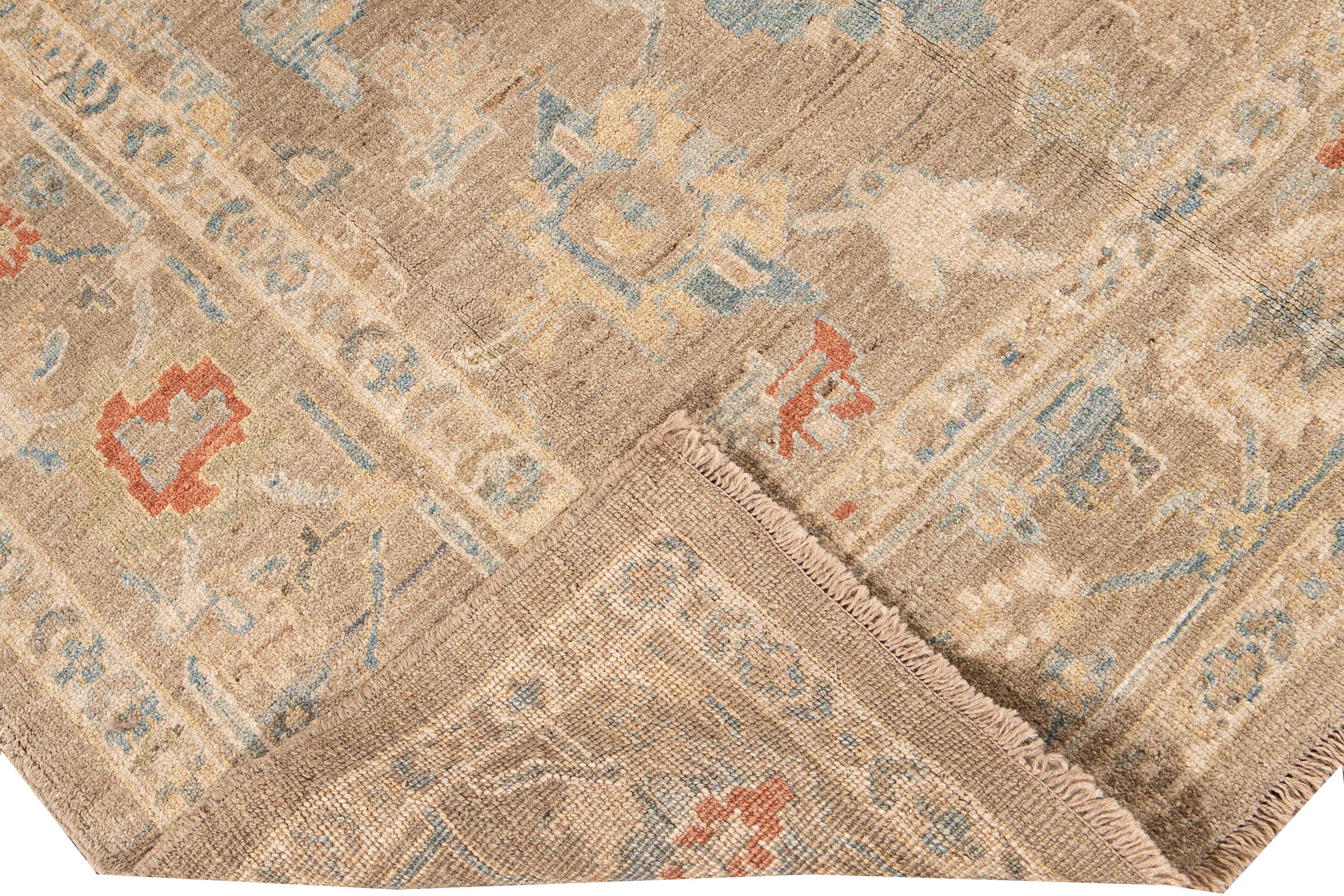 Beautiful modern Sultanabad hand-knotted wool rug with a nude field. This Sultanabad rug has Ivory, yellow, blue, green, and orange accents in a gorgeous all-over geometric floral design.

This rug measures: 6'2