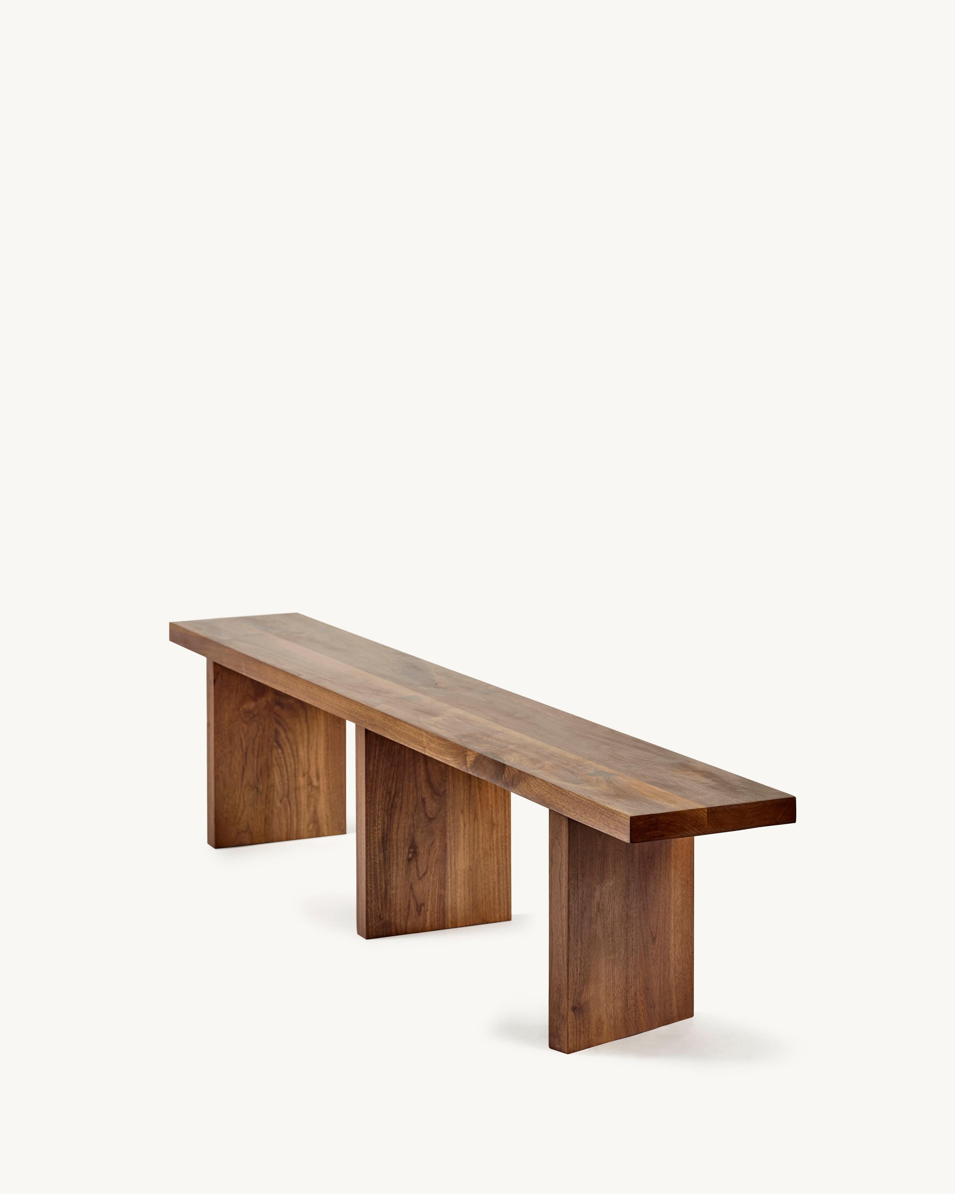 Bench in Walnut 'Solid' by Atelier 365 x Valerie Objects
Dimensions: H. 45 x W. 200 D. 35 (Large)

Fascinated by traditional wood joints, Greindl constructs wooden furniture without any nails or screws. Every joint is cut by hand, using chisels and