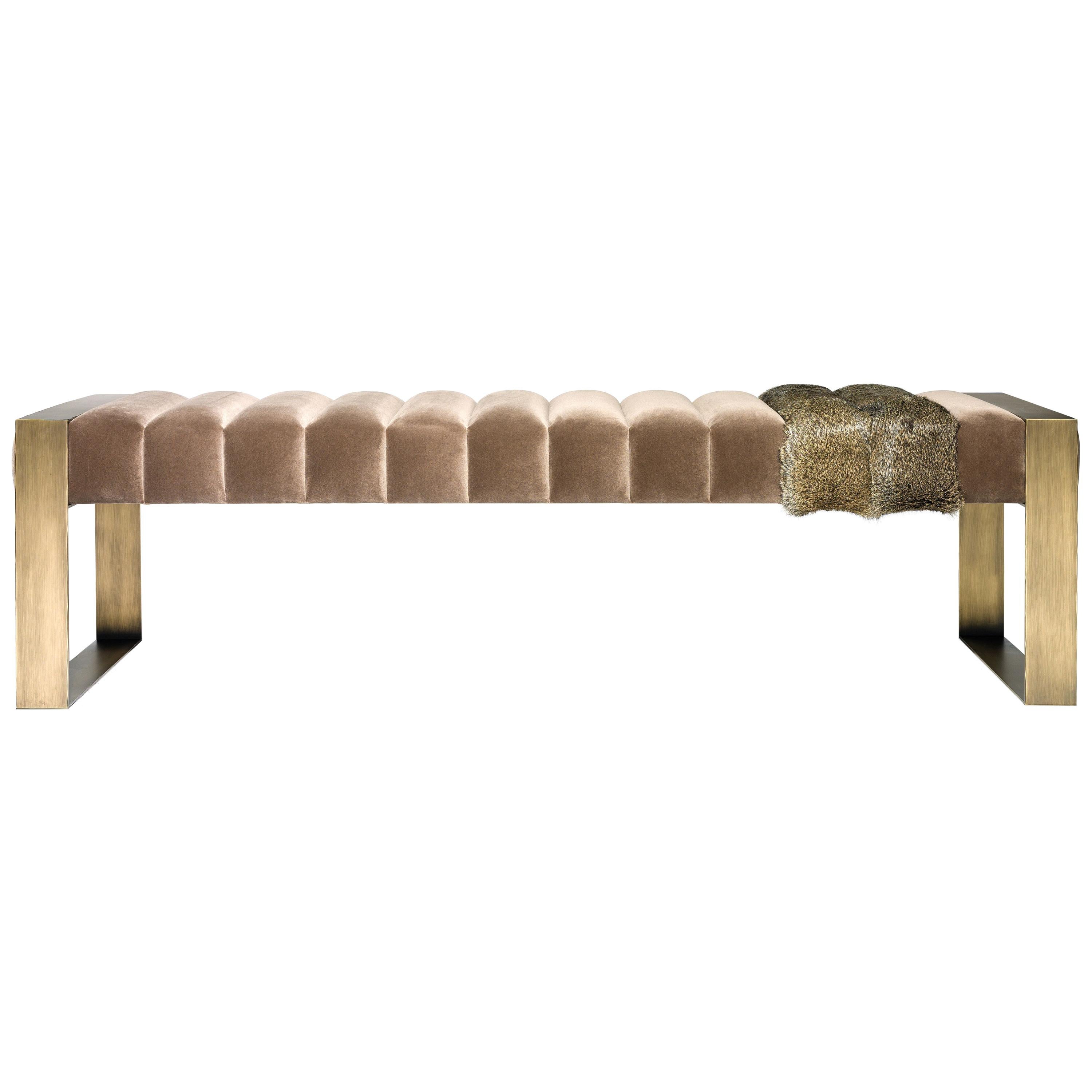 Contemporary bench is a statement design piece. This contemporary upholstered piece with an interesting twist of two fur strips. It evokes strength with the use of straight lines while the fur elements add a touch of luxury. This is an incredibly