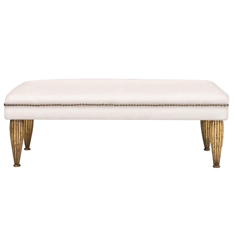 Contemporary bench upholstered in hide or Belgian linen and nailhead trim is part of the custom Tara Shaw Maison collection. Handcrafted in New Orleans. Standard bench available upholstered in white cowhide or linen.

Custom dimensions, finish and
