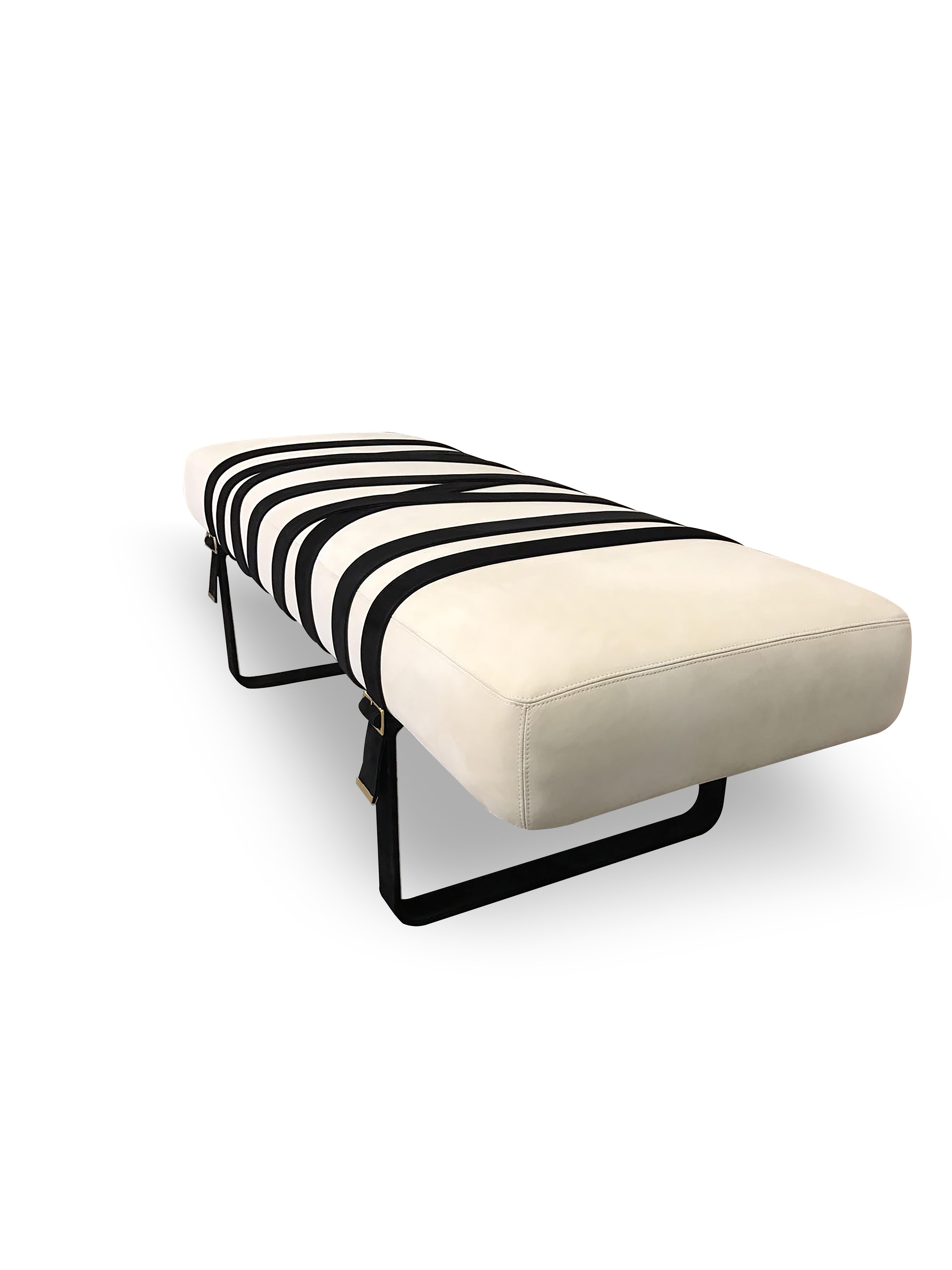 Inspired by the sensual fashion of Italy this modern leather bench lets you indulge in haute furniture design. The softly upholstered seat rests on the leather belt that wraps around the entire bench as the fashion-inspired design detail. 

As
