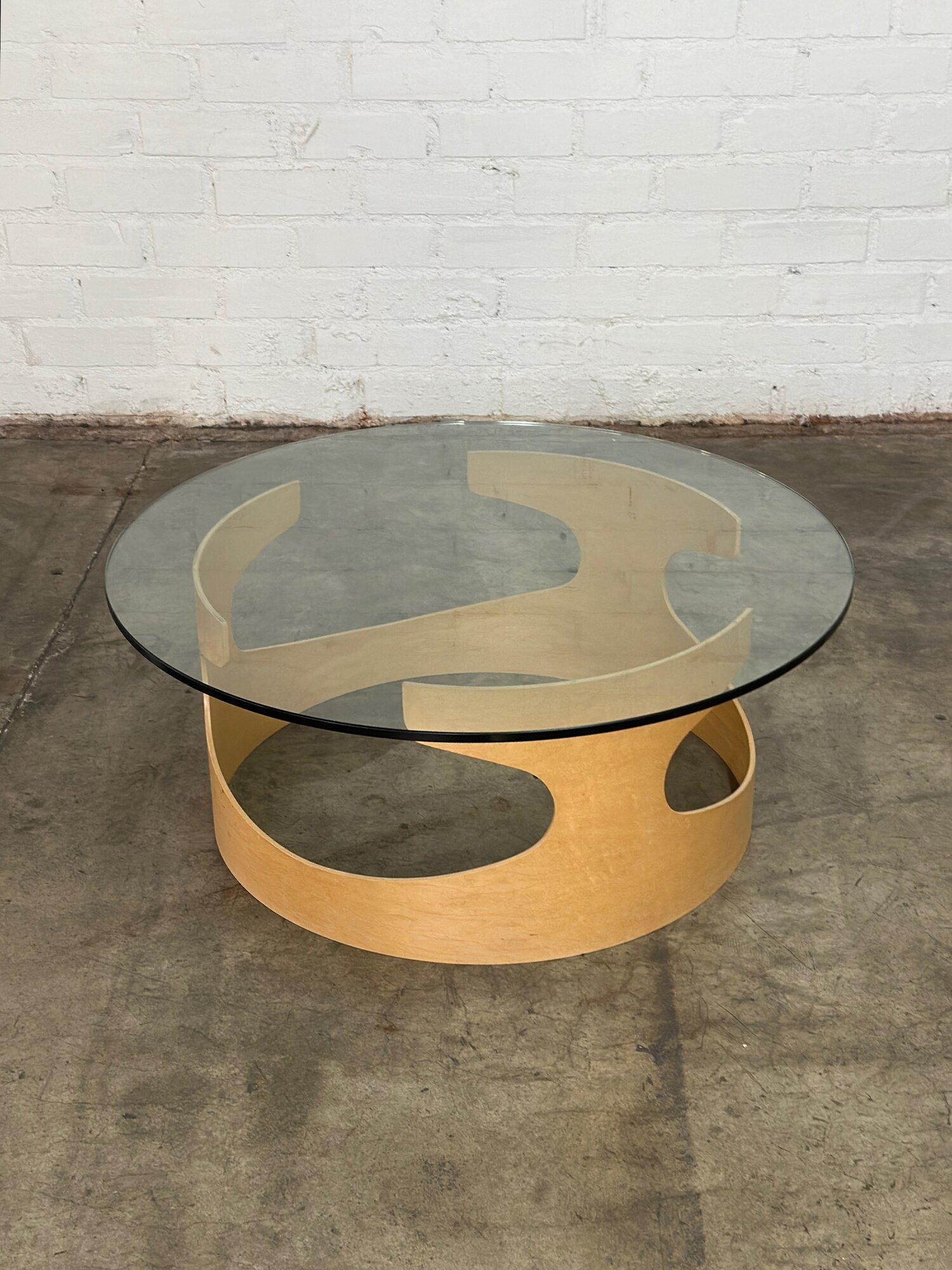 W36 H14.5

Contemporary Bentwood base coffee table with a glass round top by In House Furniture. Areas of wear have been pictured. 