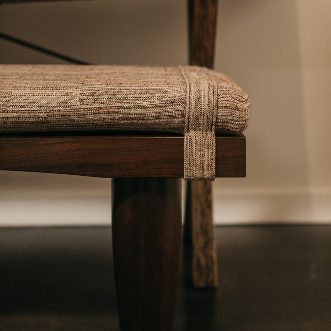 Contemporary walnut bench with tapered round legs reupholstered by the Selby House in an Anne Kirk linen.