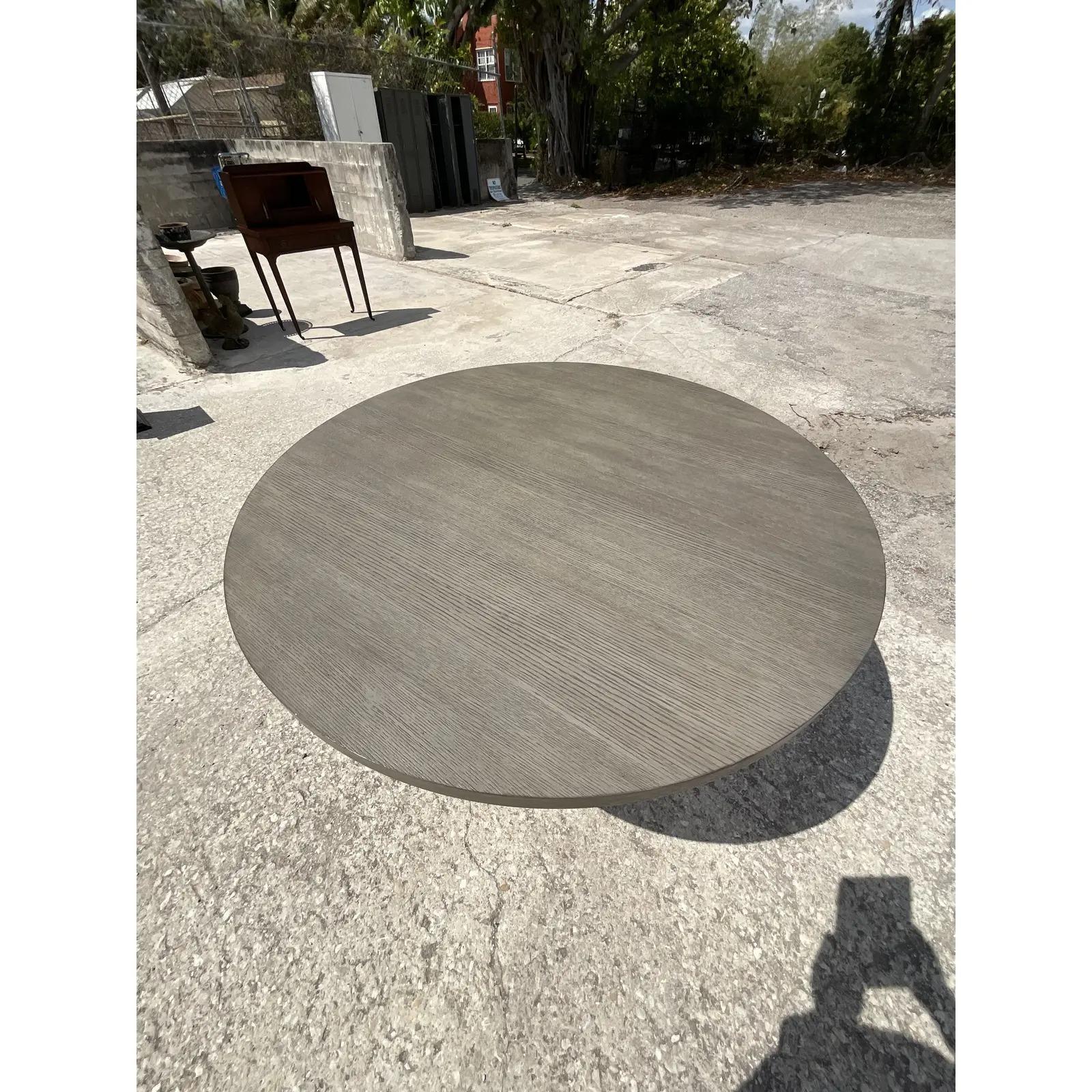 Fantastic vintage Bernhardt dining table. Beautiful Contemporary design with a matte white oak wood top and a sleek modern cast pedestal. A real chameleon that works beautiful with so many decors. Acquired from a Palm Beach estate.