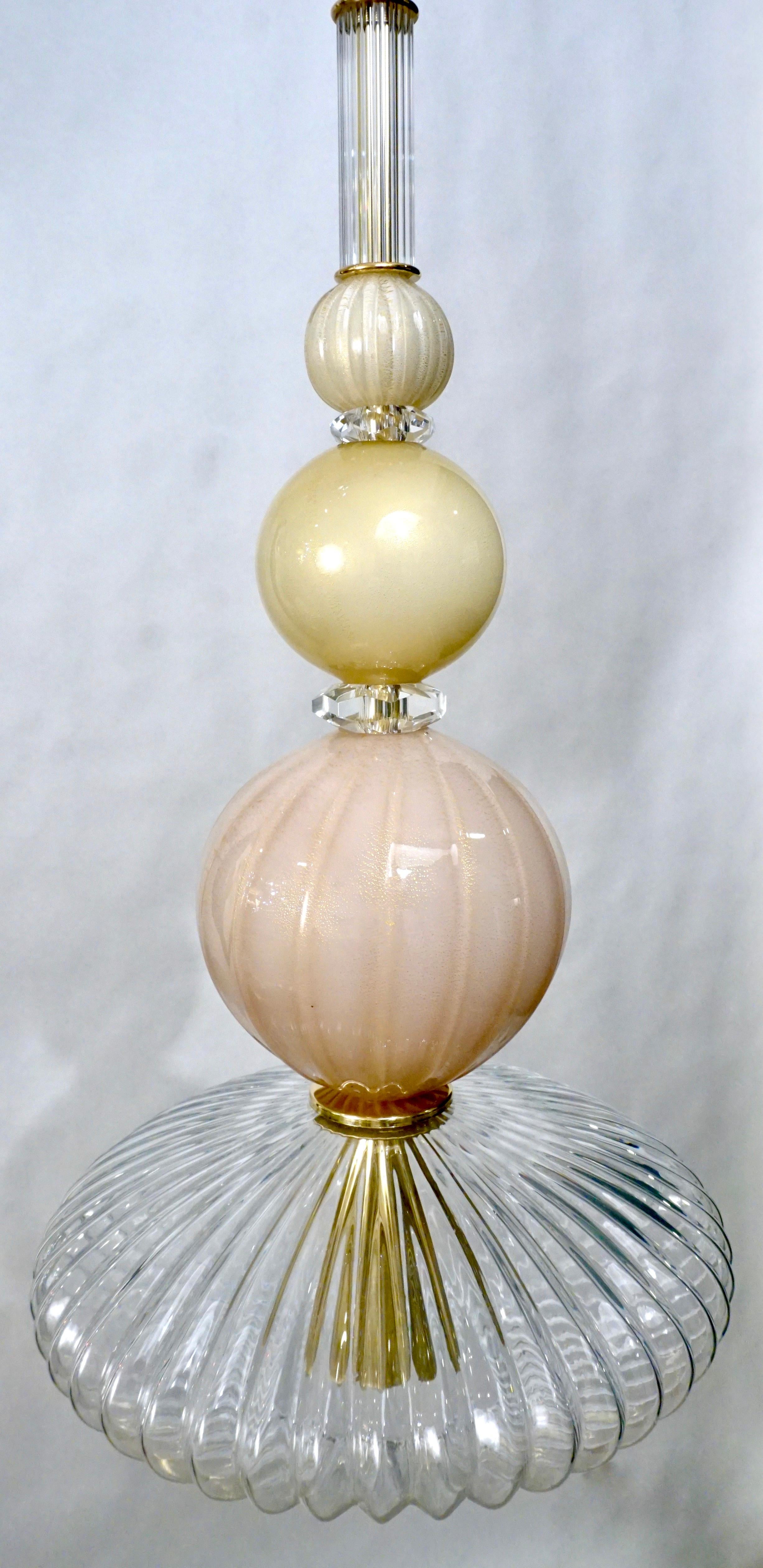 Fun and elegant Italian lantern chandelier, entirely handcrafted, of organic modern design consisting of a succession of elements reeded crystal Murano glass cylinder, opaline rose pink blush and ivory white glass spheres overlaid in clear crystal