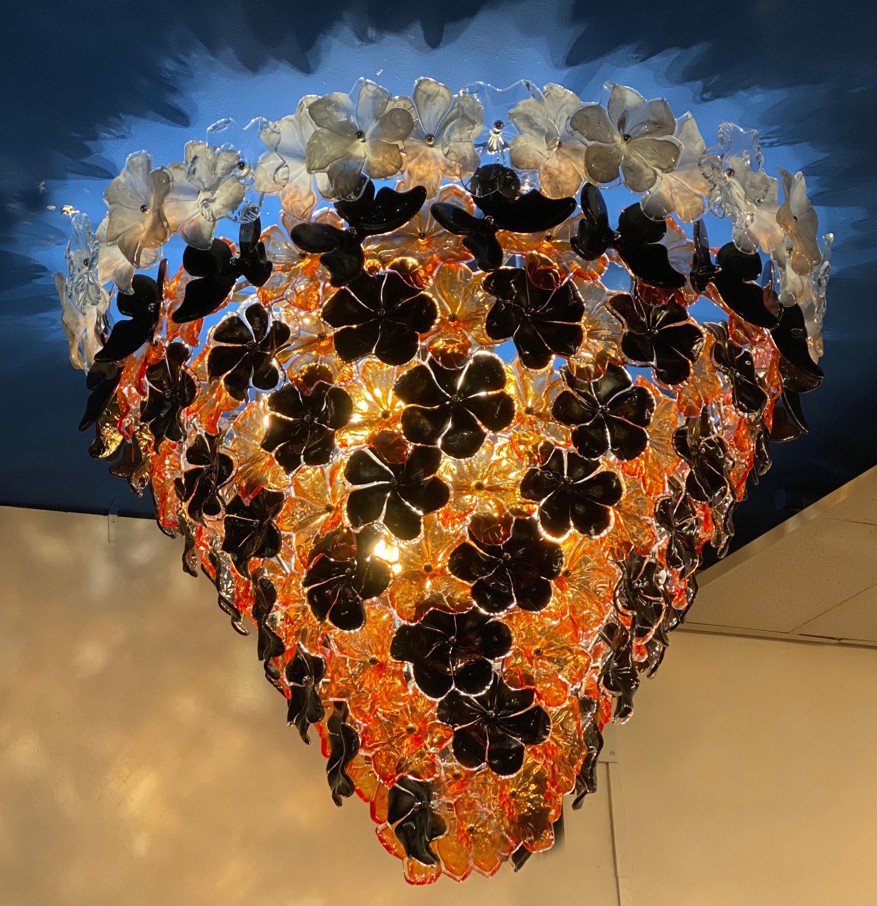 Striking contemporary Murano glass chandelier composed by dozens black orange and white hand blown flowers and by Galleria Veneziani.
 