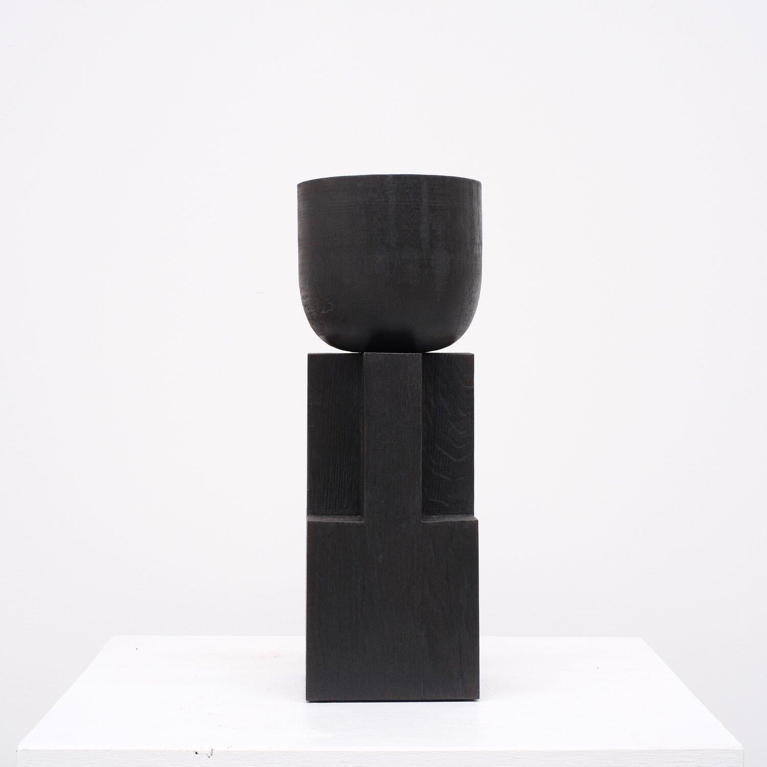 Contemporary Black Bowl in Iroko Wood, Goblet Bowl by Arno Declercq

Material: Burned Iroko Wood and Oak
Dimensions: Dimensions: 40 cm H x 14 cm W x 14 cm D

Made by hand, in Belgium.

Arno Declercq
Belgian designer and art dealer who makes