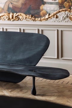 Contemporary black burned and sculpted bench