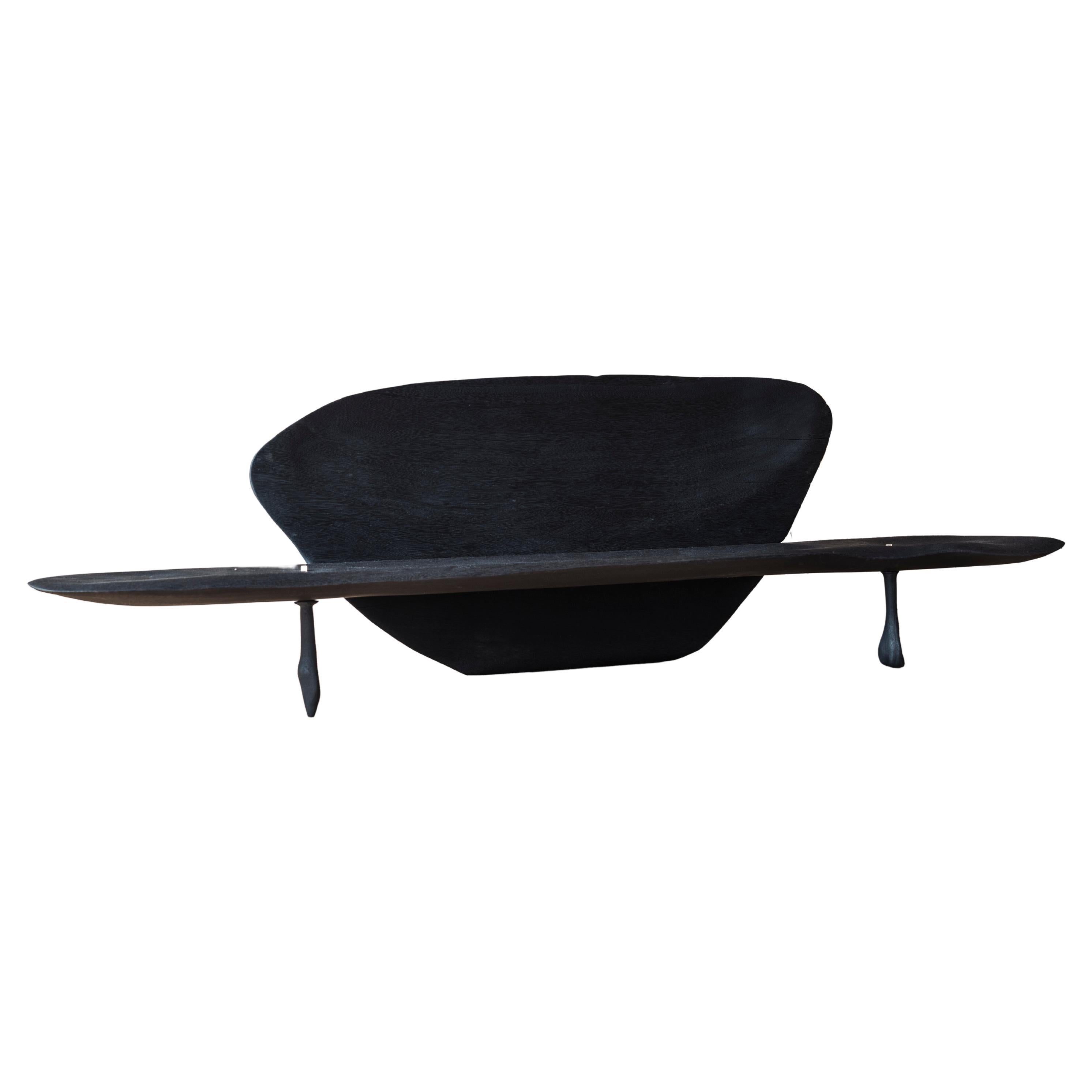 Contemporary black burned and sculpted bench